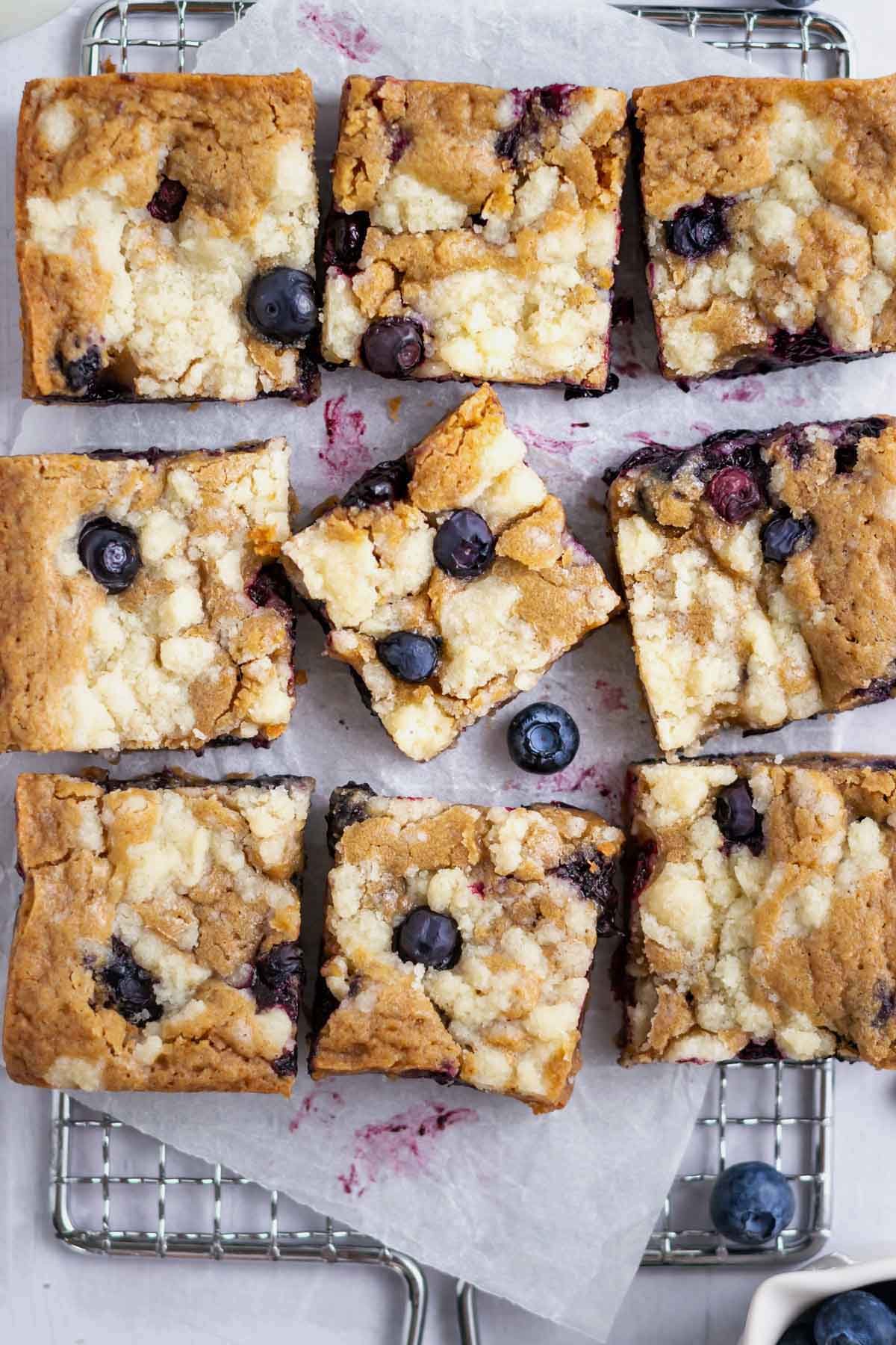 blondie bars on a parchment lined rack