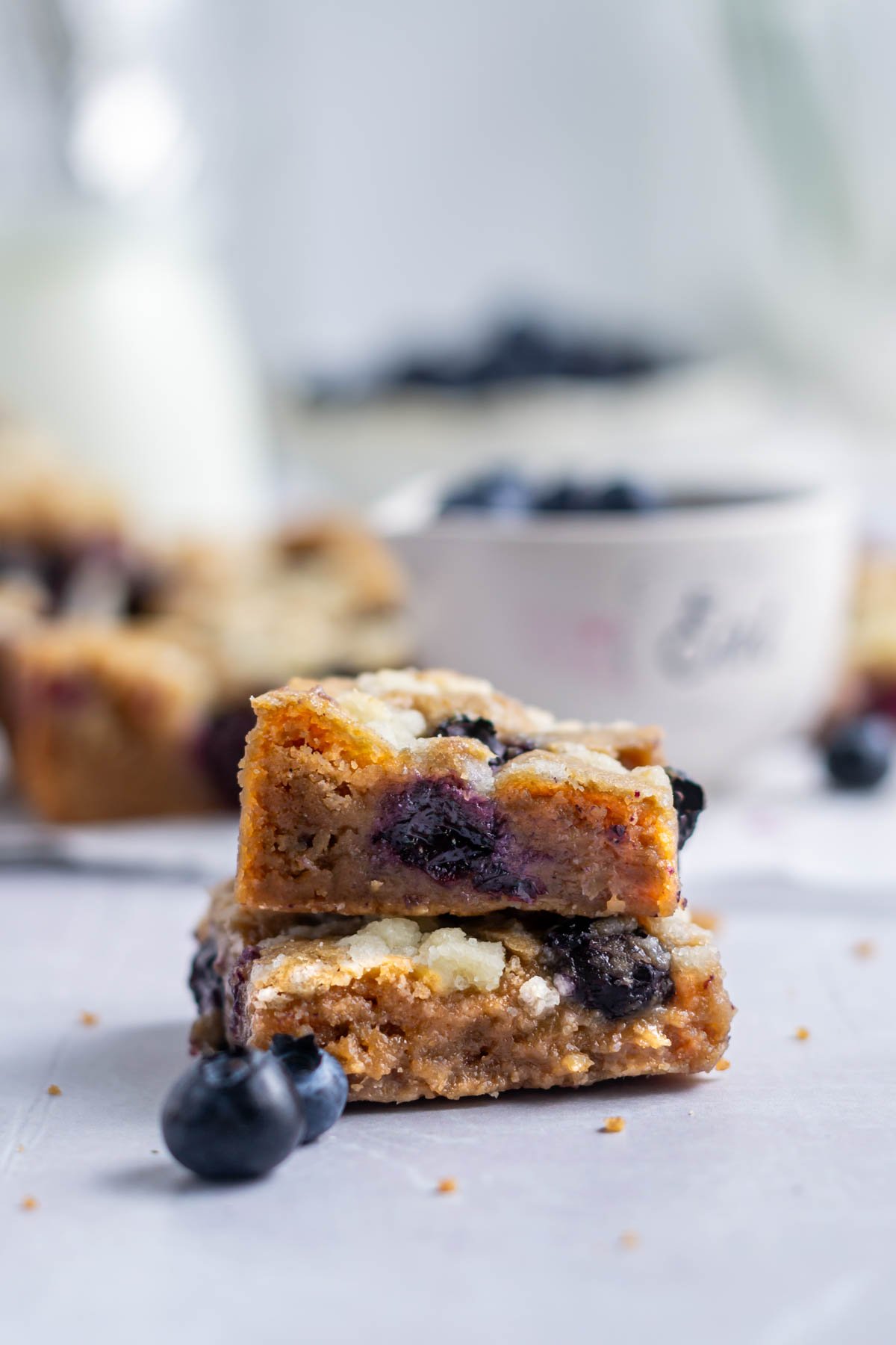 two blondie bars with blueberries