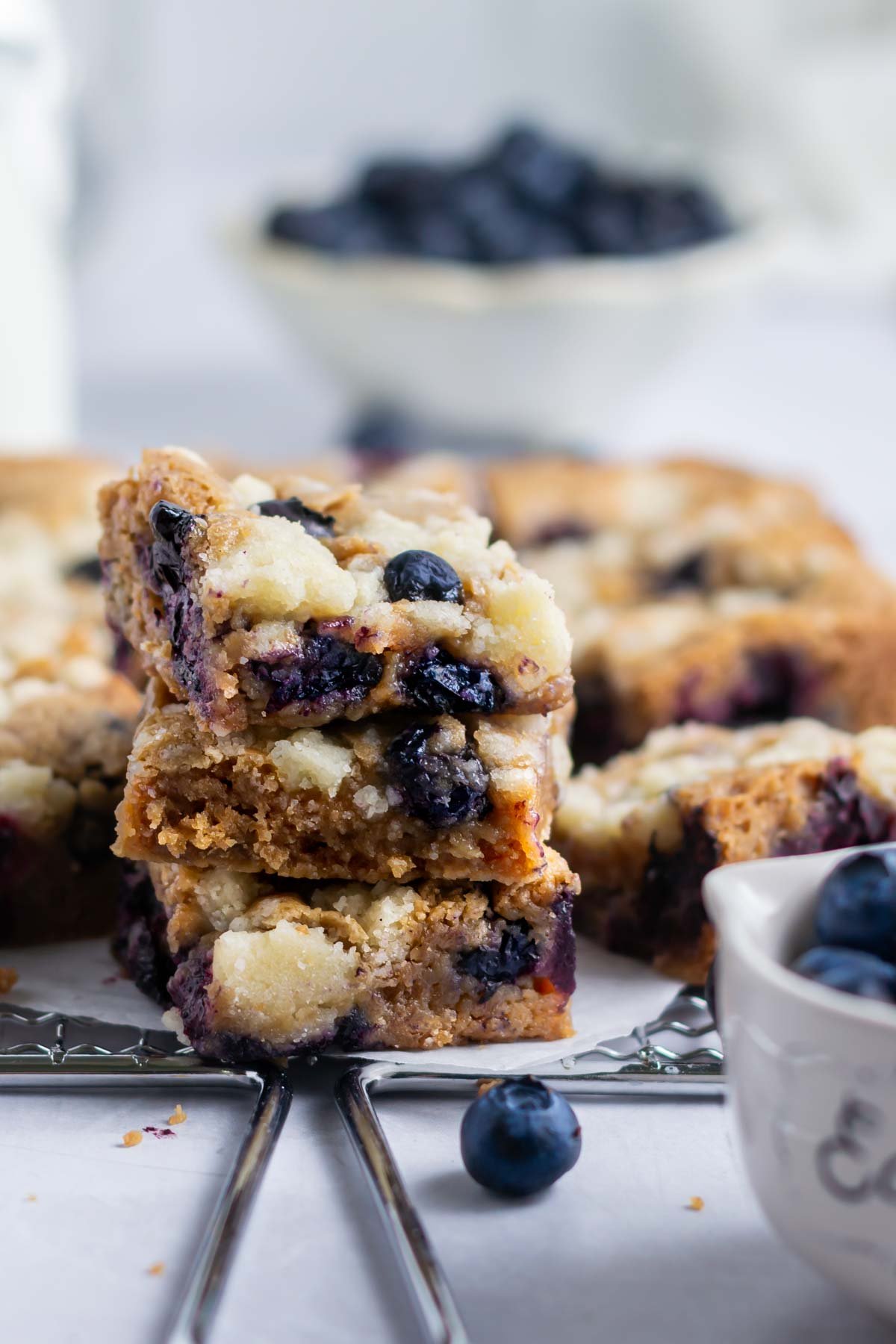 Three blueberry blondies in a stack