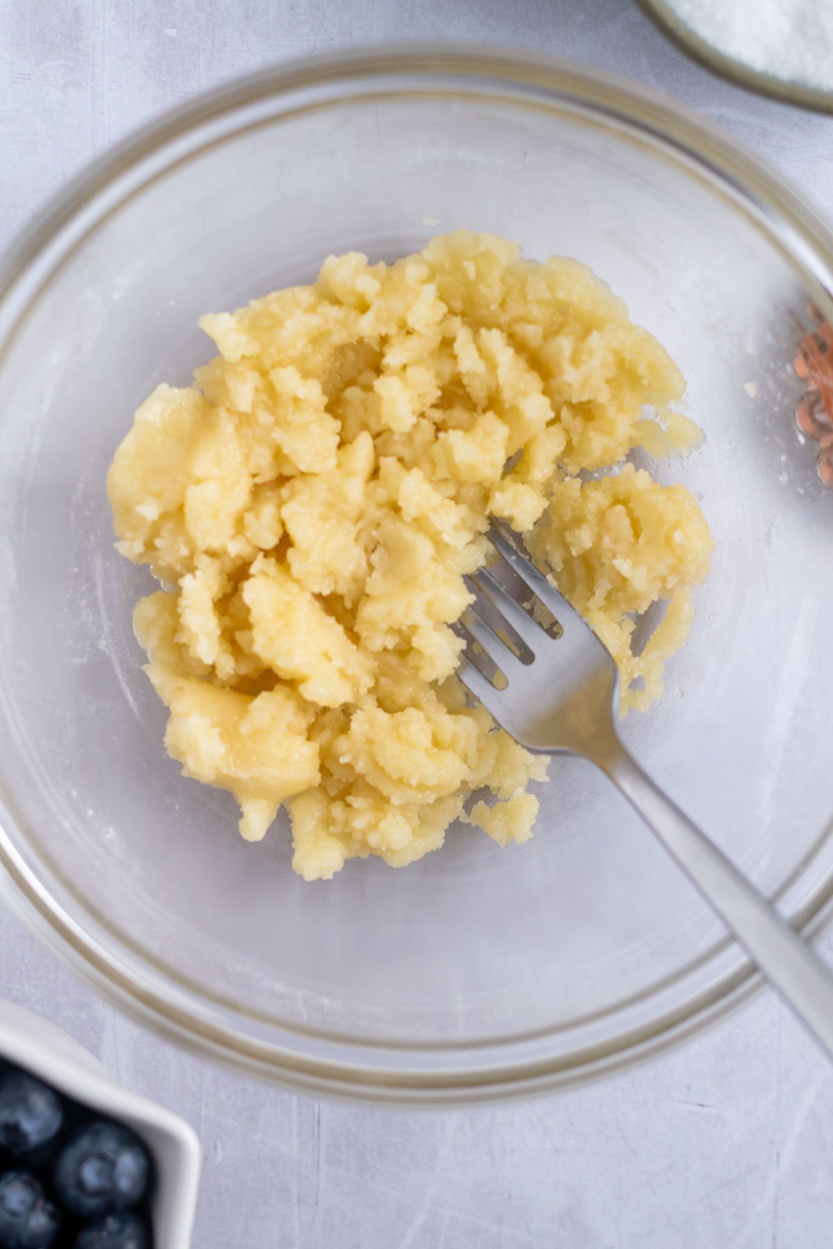 crumble topping in a bowl with a fork