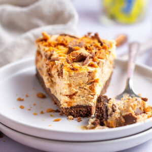 slice of butterfinger pie on a plate with a fork