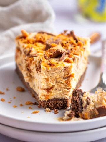 slice of butterfinger pie on a plate with a fork