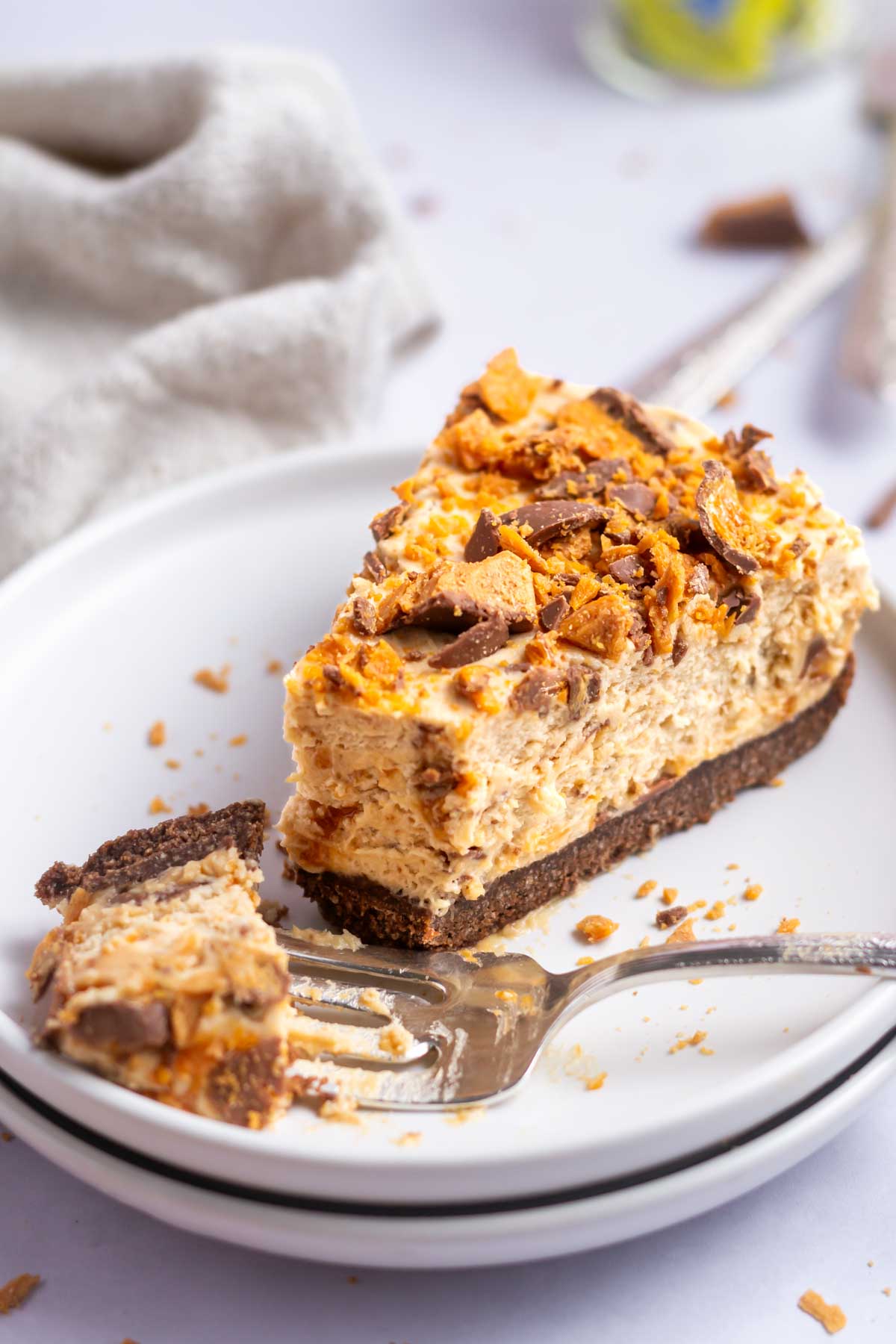 slice of butterfinger pie on a plate with a fork