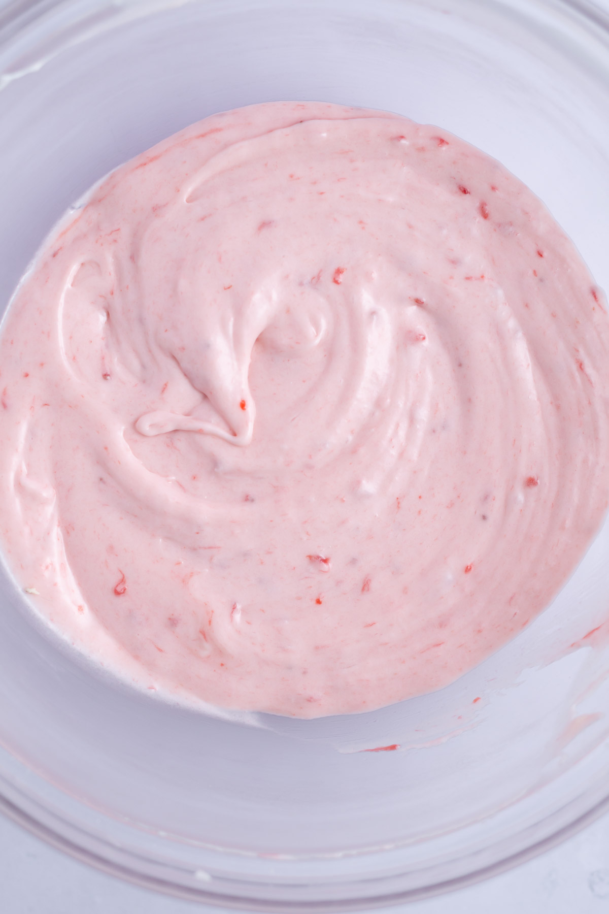 strawberry cream cheese icing in a bowl
