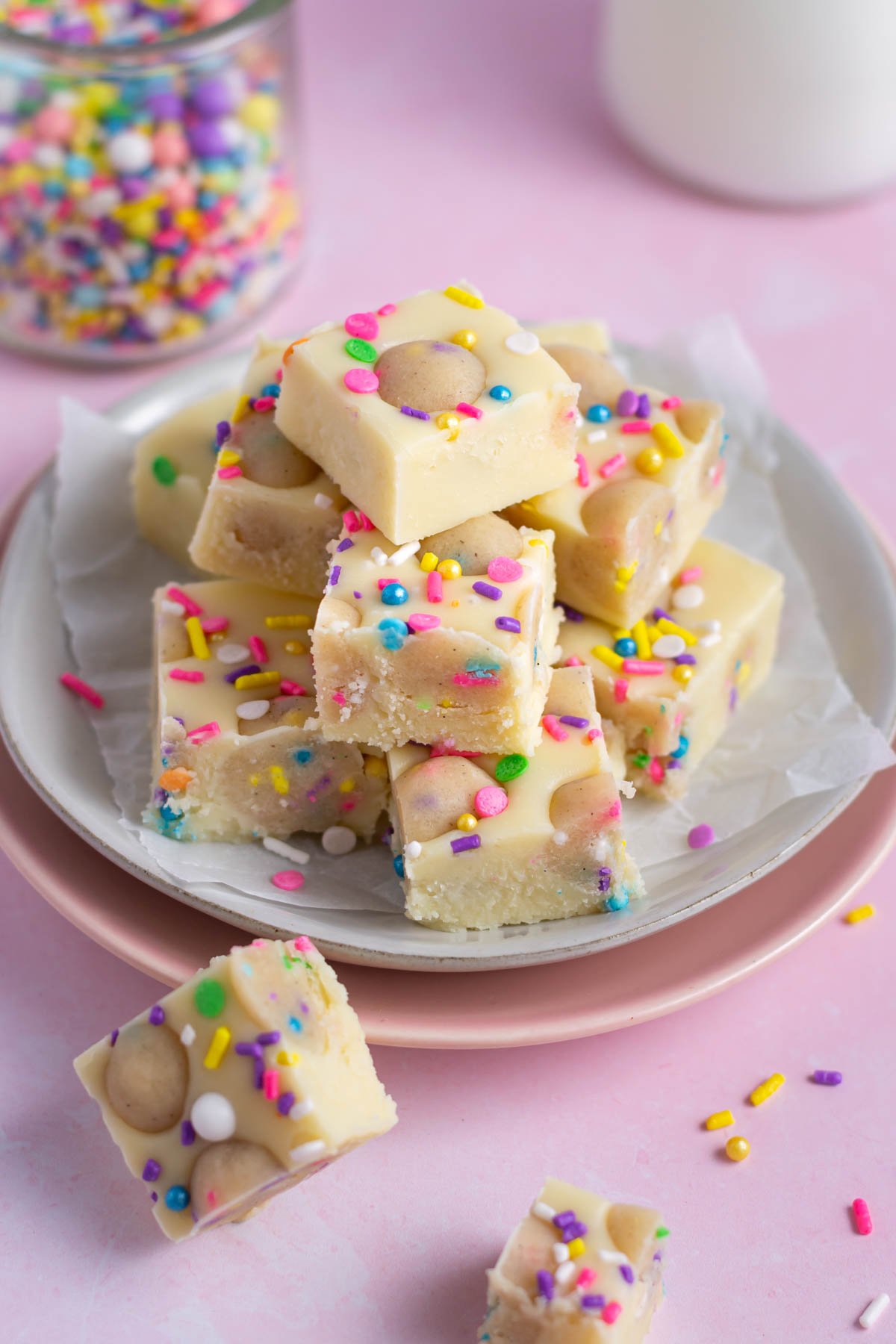 sugar cookie fudge on a parchment lined plate