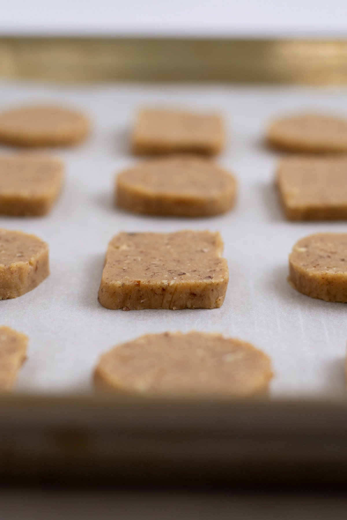 unbaked homemade crackers on a baking sheet
