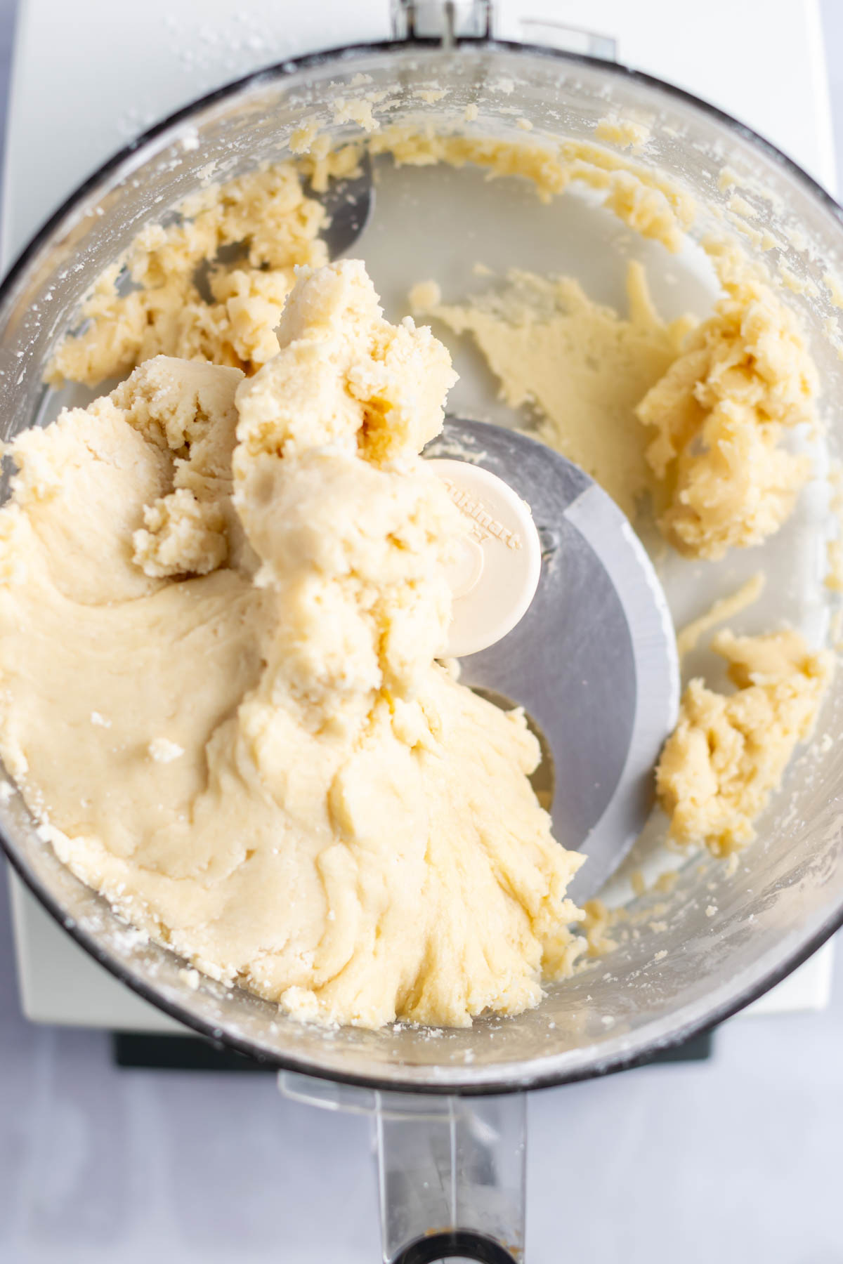cookie dough in the bowl of a food processor