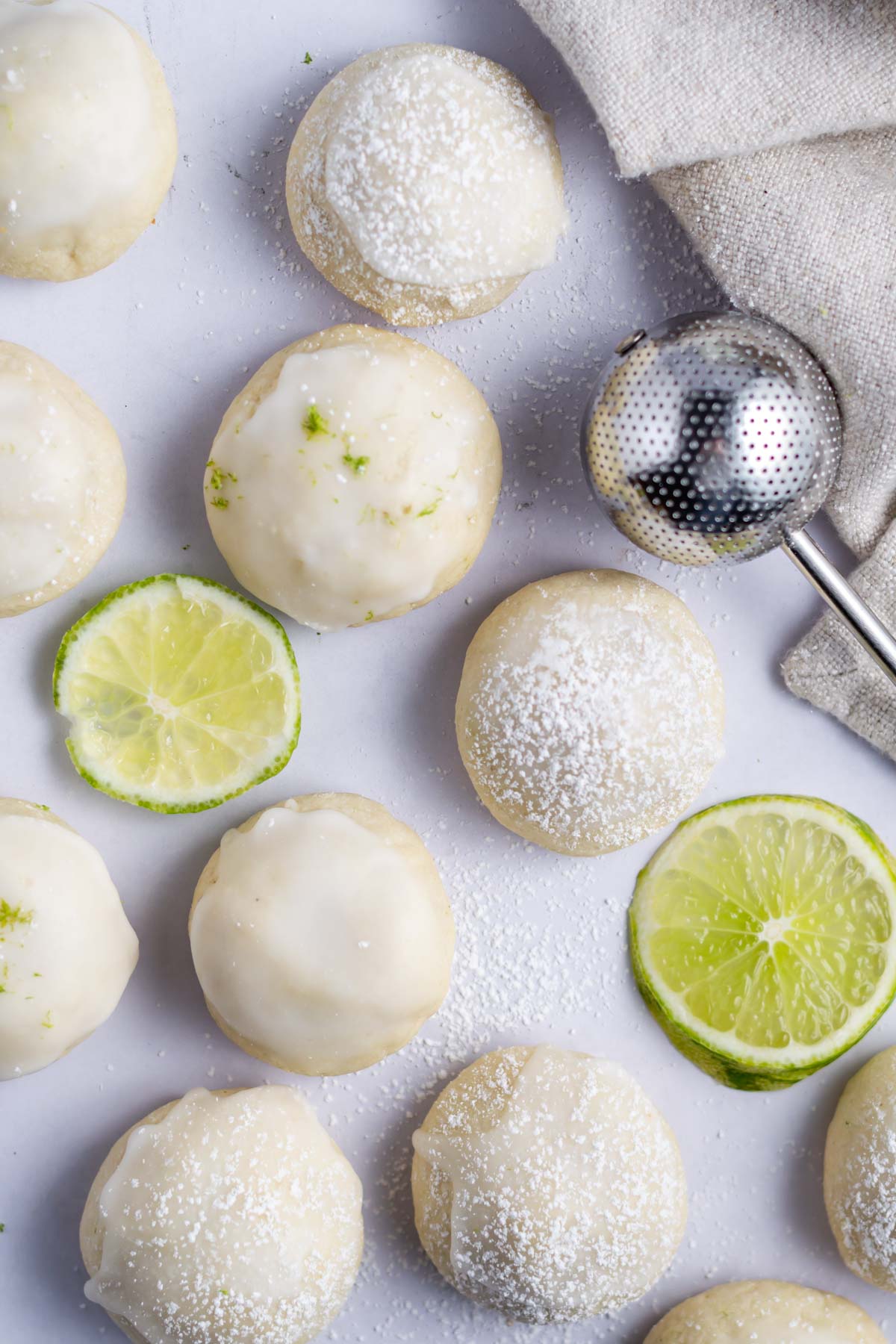 lime cookies, some with glaze and lime zest and some with confectioners's sugar