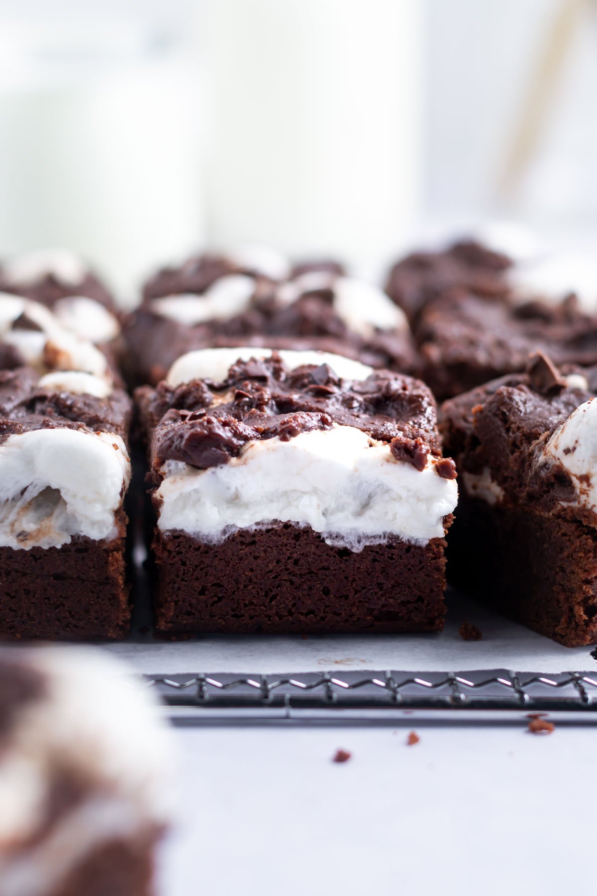 layered brownies on a parchment lined cooling rack