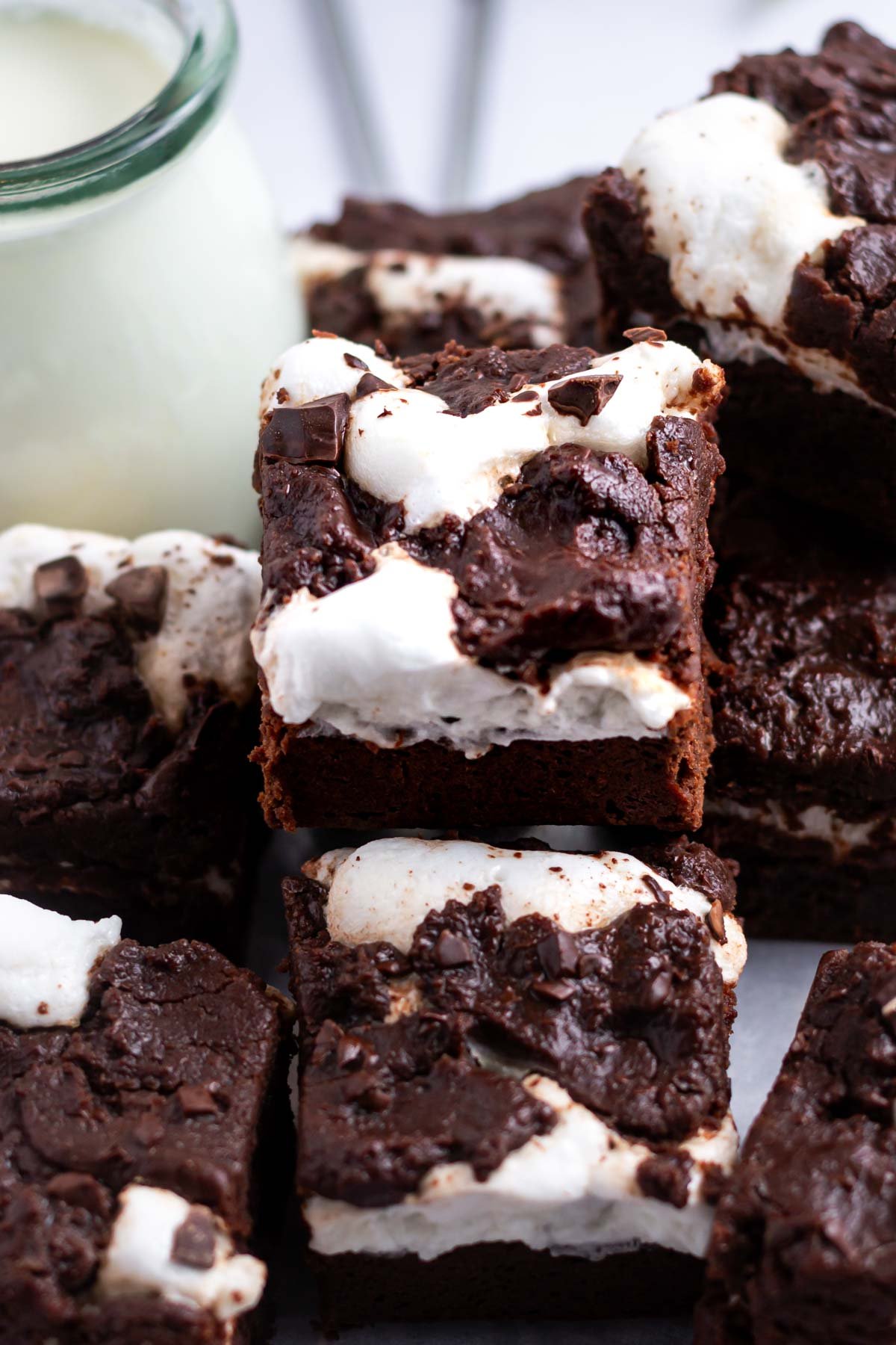 pile of brownies with a glass of milk