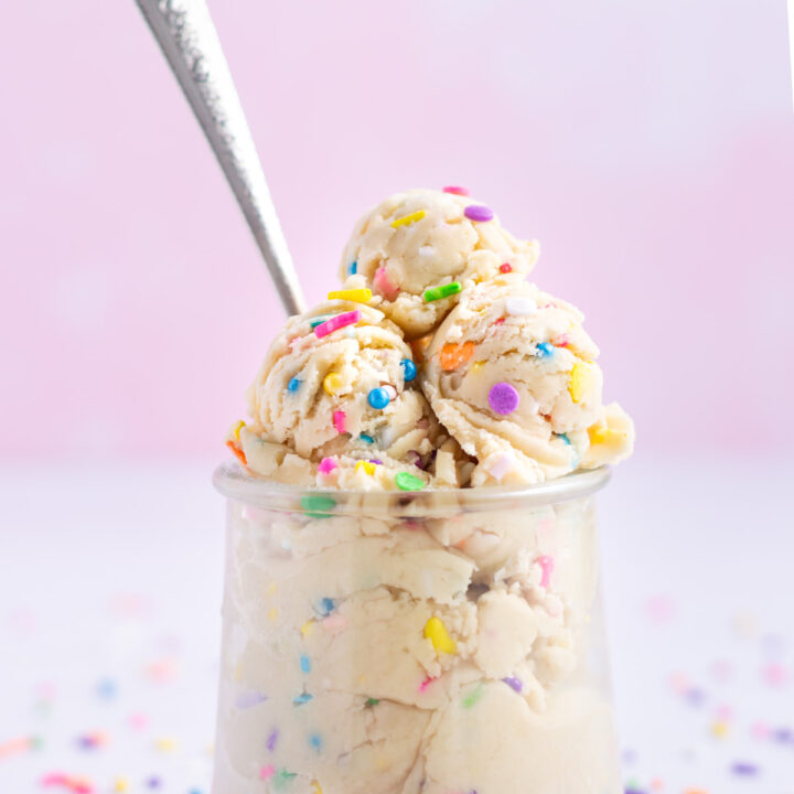 edible sugar cookie dough in a glass jar with a spoon