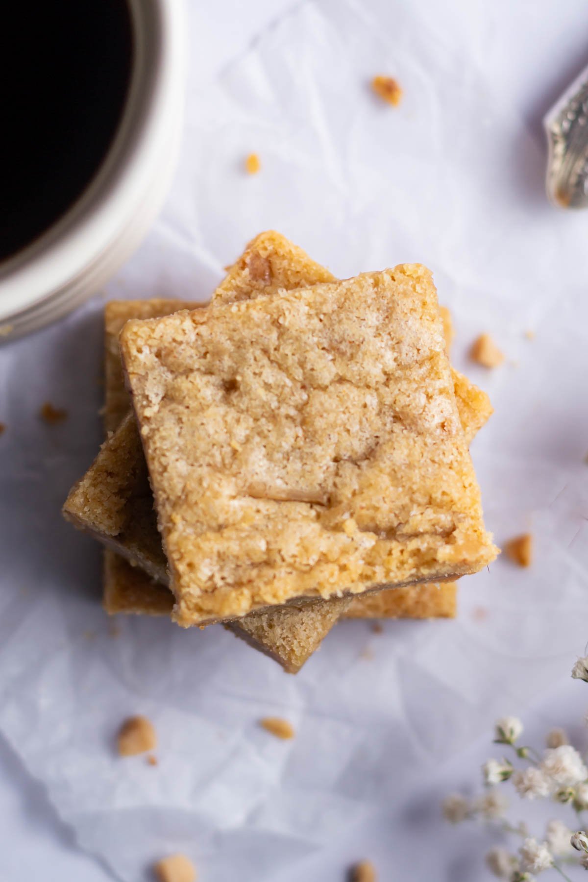 overhead look at the crinkly top on blondies with a cup of coffee