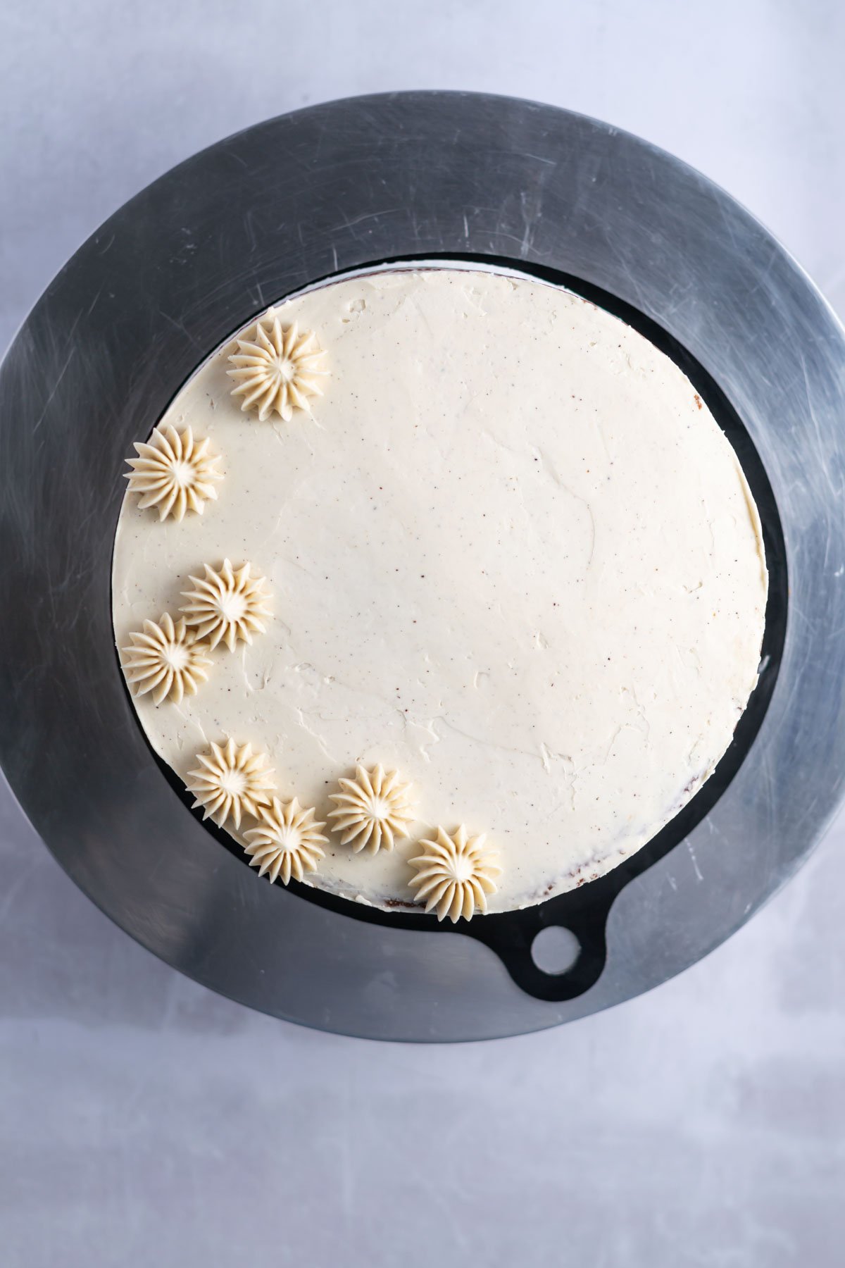 cream colored piping on a cake top