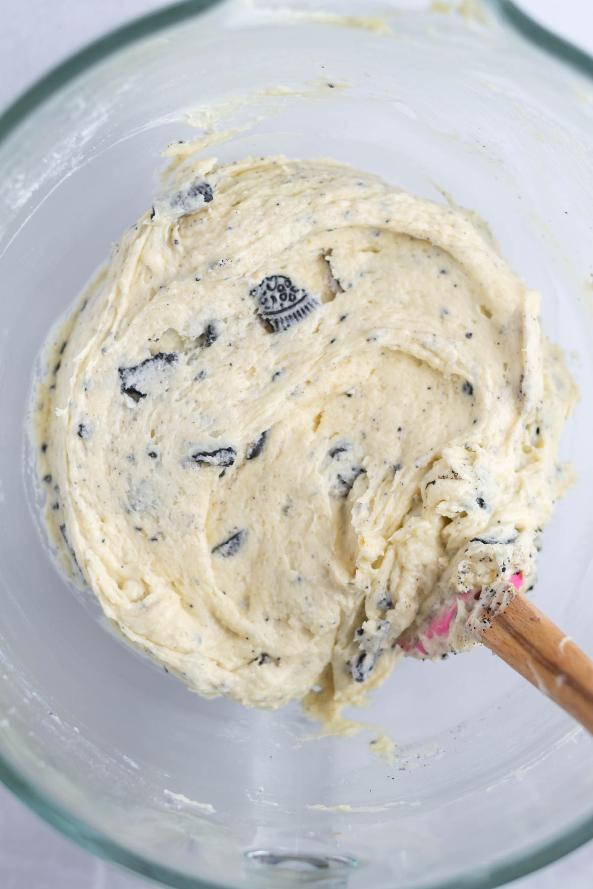 oreo pound cake batter in a mixing bowl with a spatula