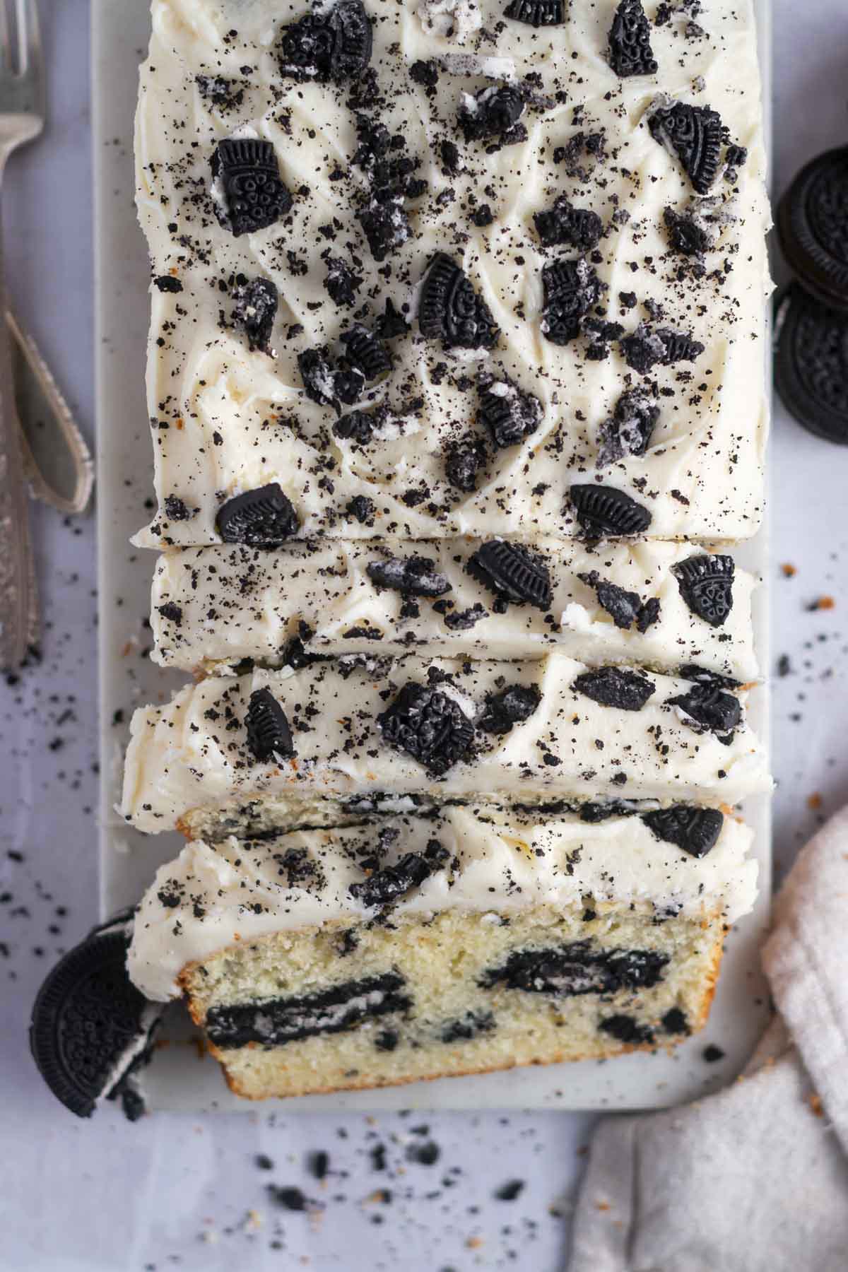 overhead look at slices of cake with oreo pieces on top of the icing