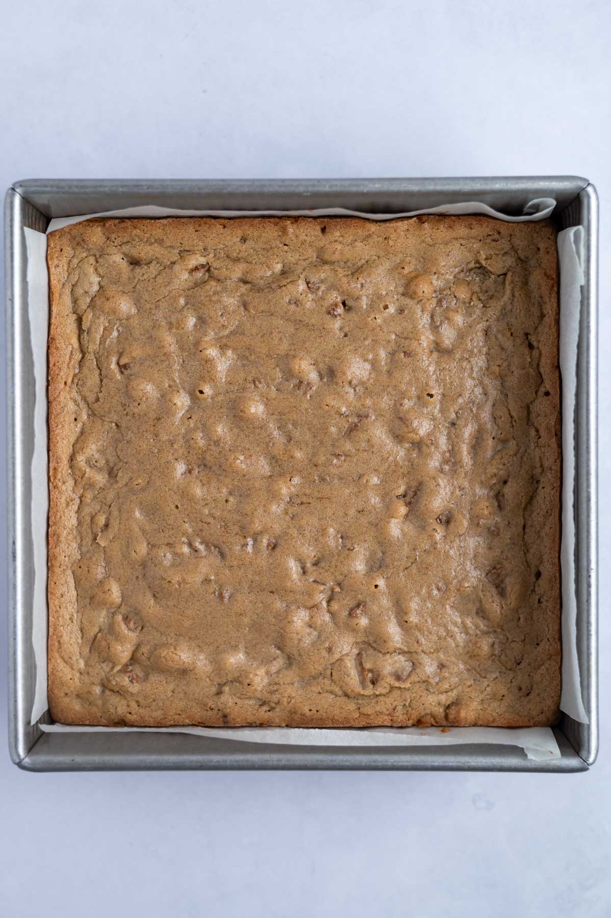 baked bars in a parchment lined baking pan