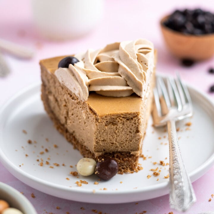 slice of espresso cheesecake on a plate with a fork