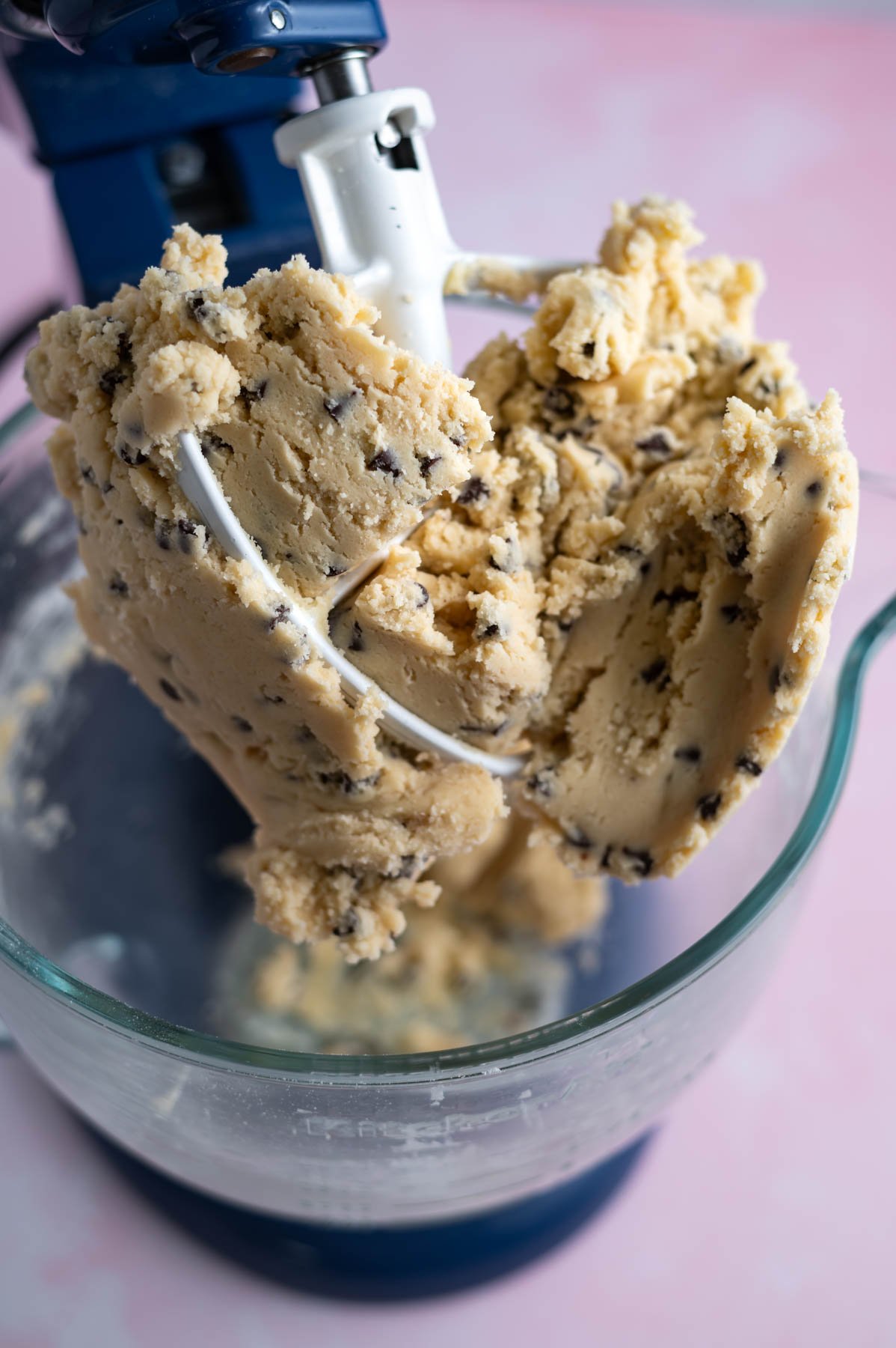 cookie dough balled up on a mixing bowl paddle