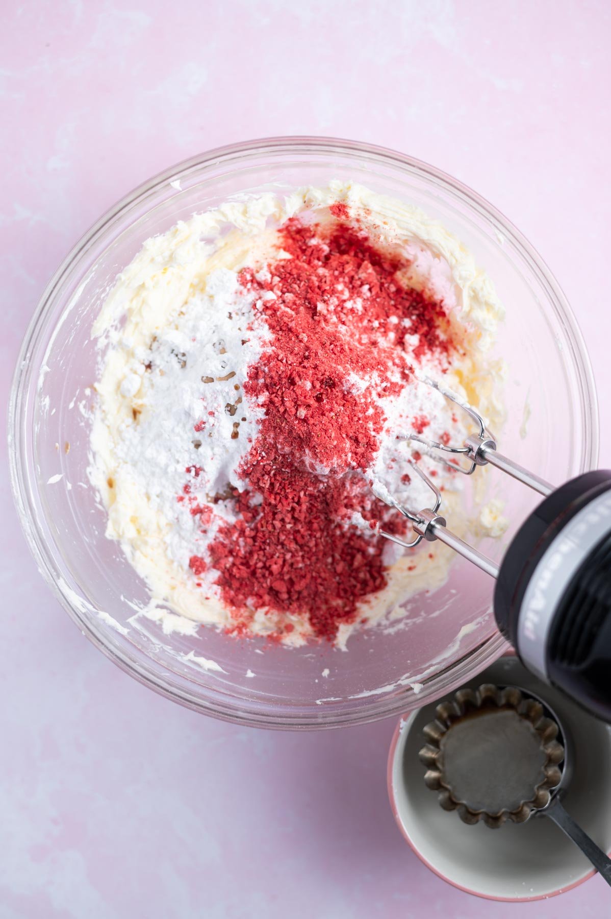 confectioners' sugar, freeze dried strawberries and vanilla added to frosting ingredients
