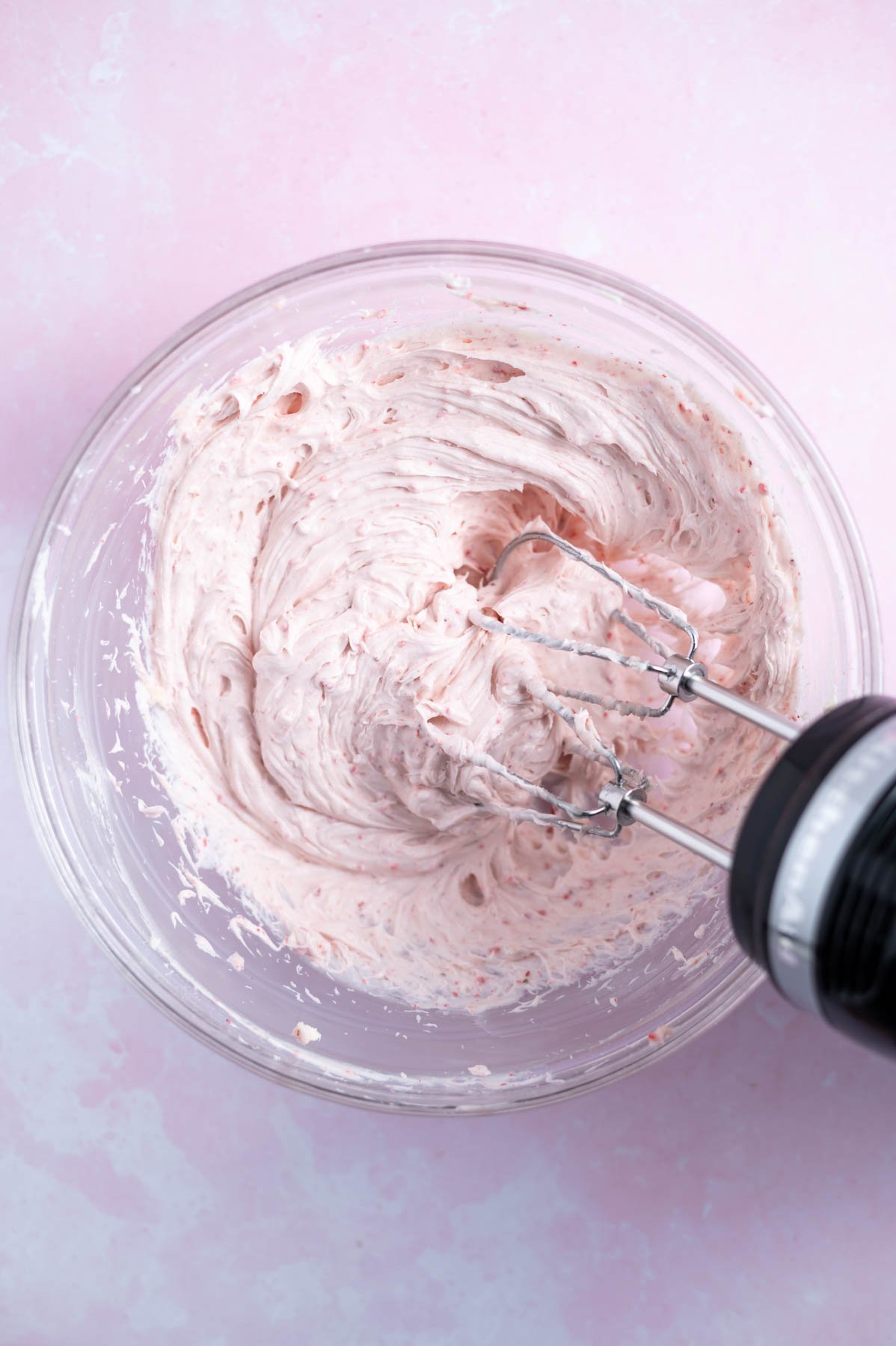 strawberry cream cheese frosting in a mixing bowl