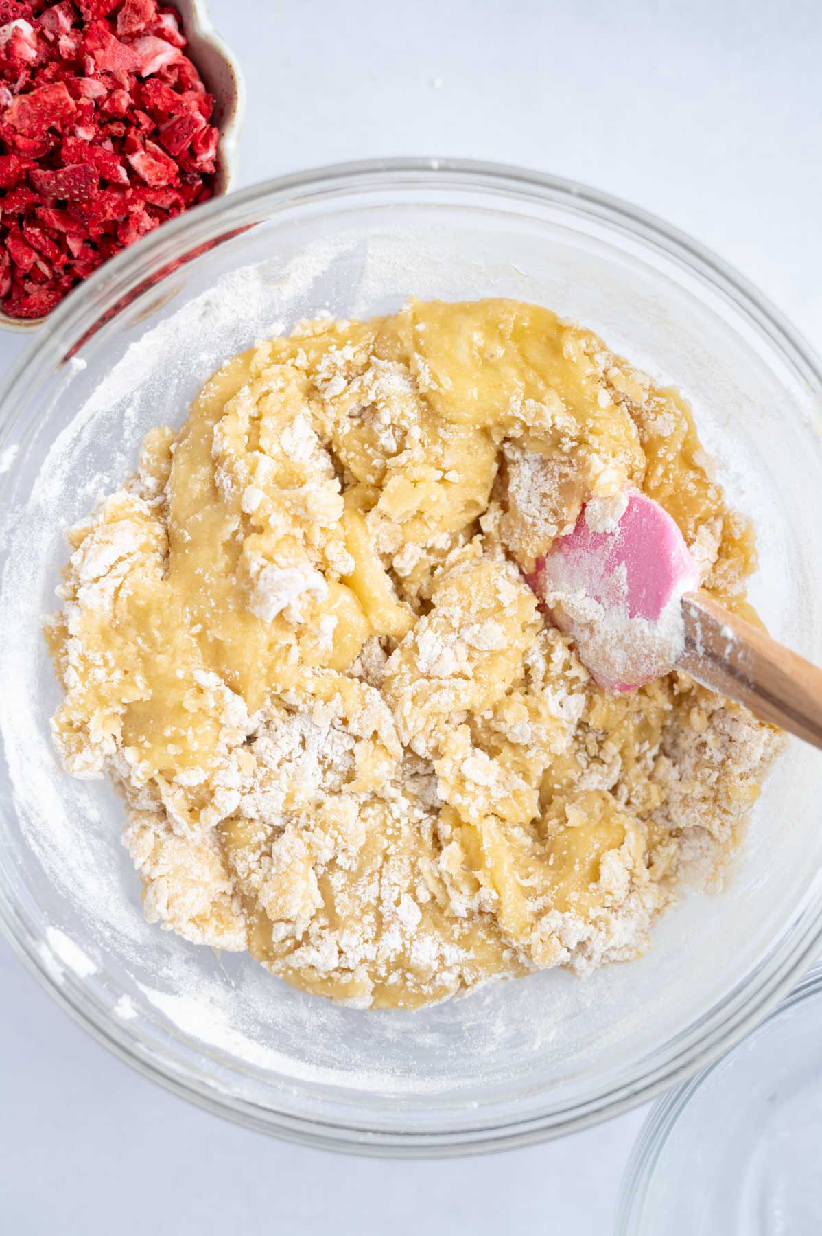 flour mixed until just a few streaks remain in a mixing bowl