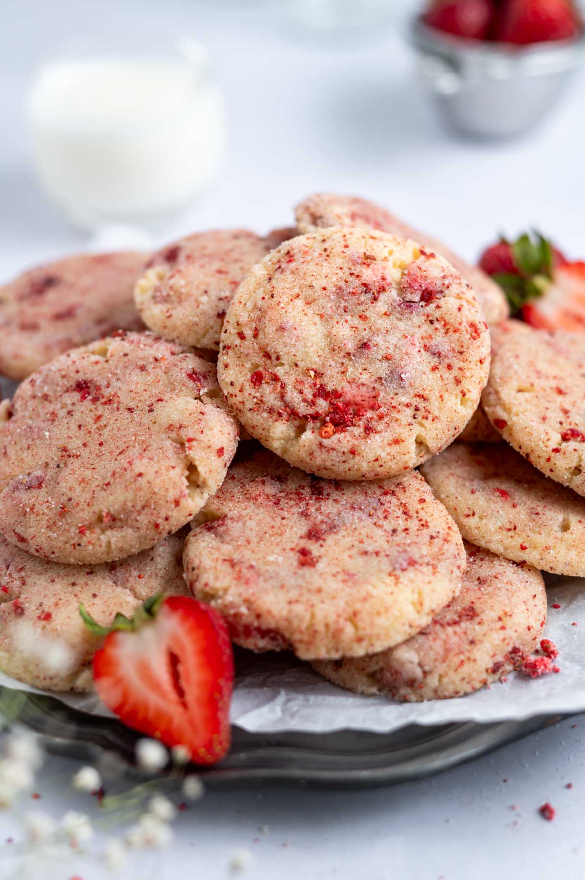 plate of cookies with milk in the background