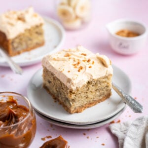 slices of cake on plate with forks and a bowl of dulce de leche