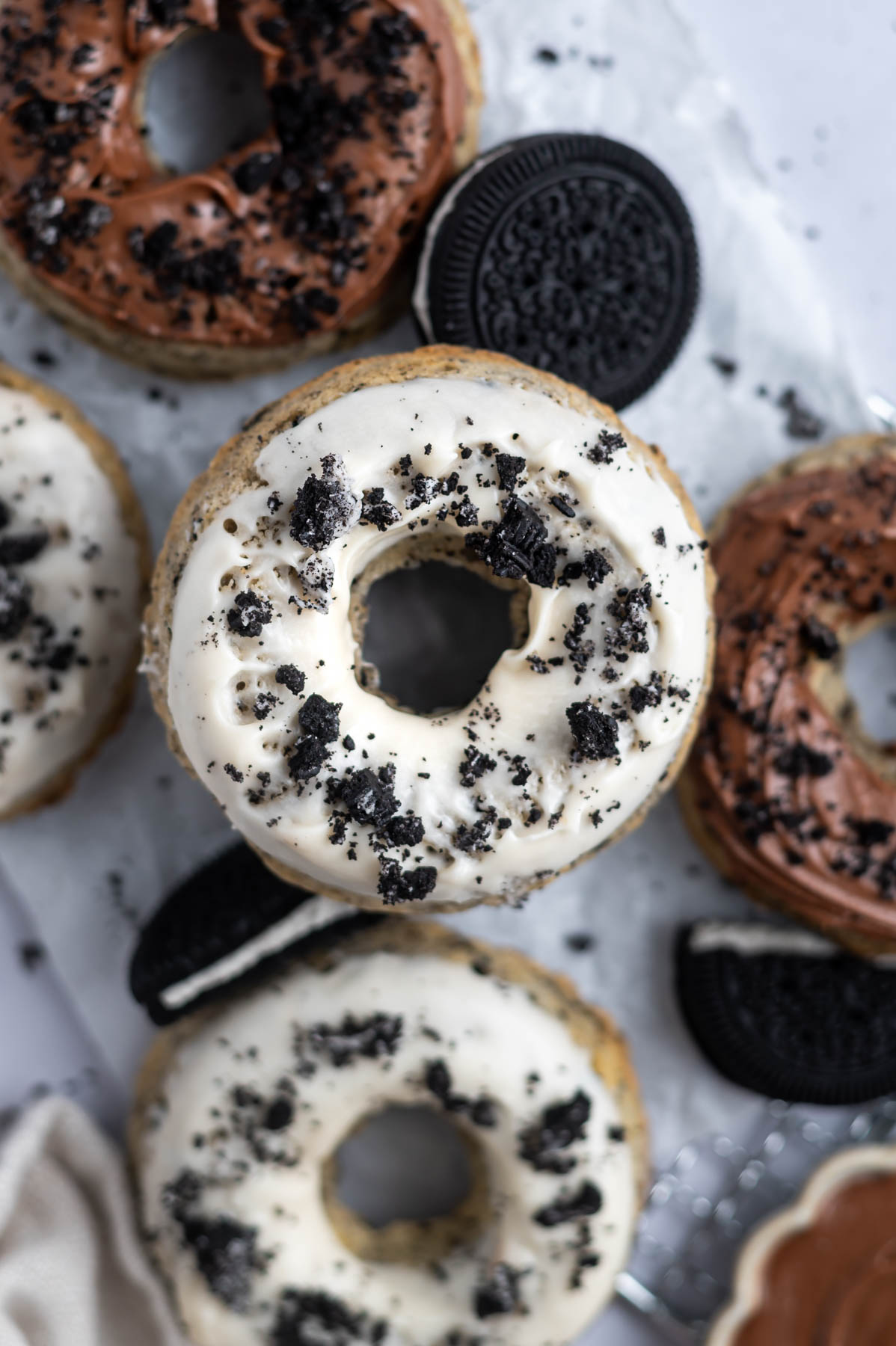 oreo donut with vanilla glaze and oreo cookie pieces