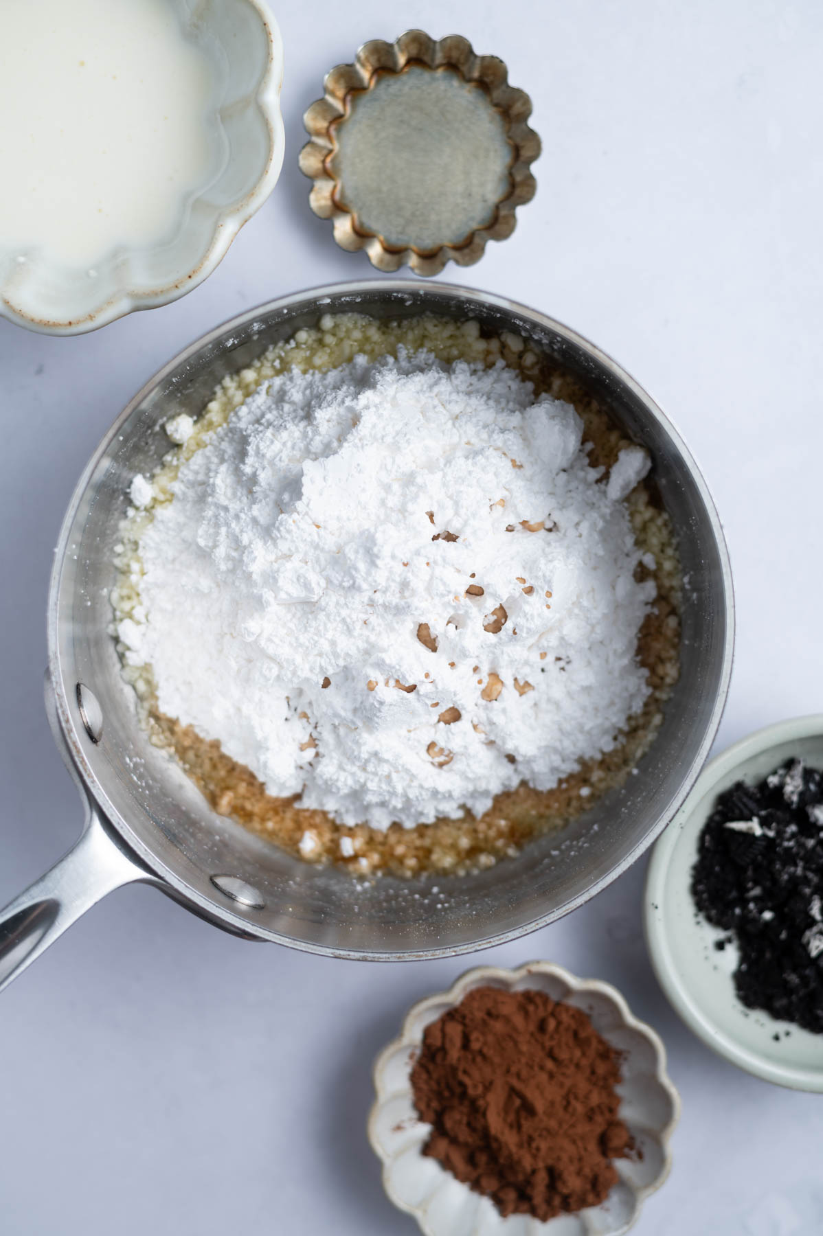 confectioners' sugar, vanilla and melted butter in a small saucepan