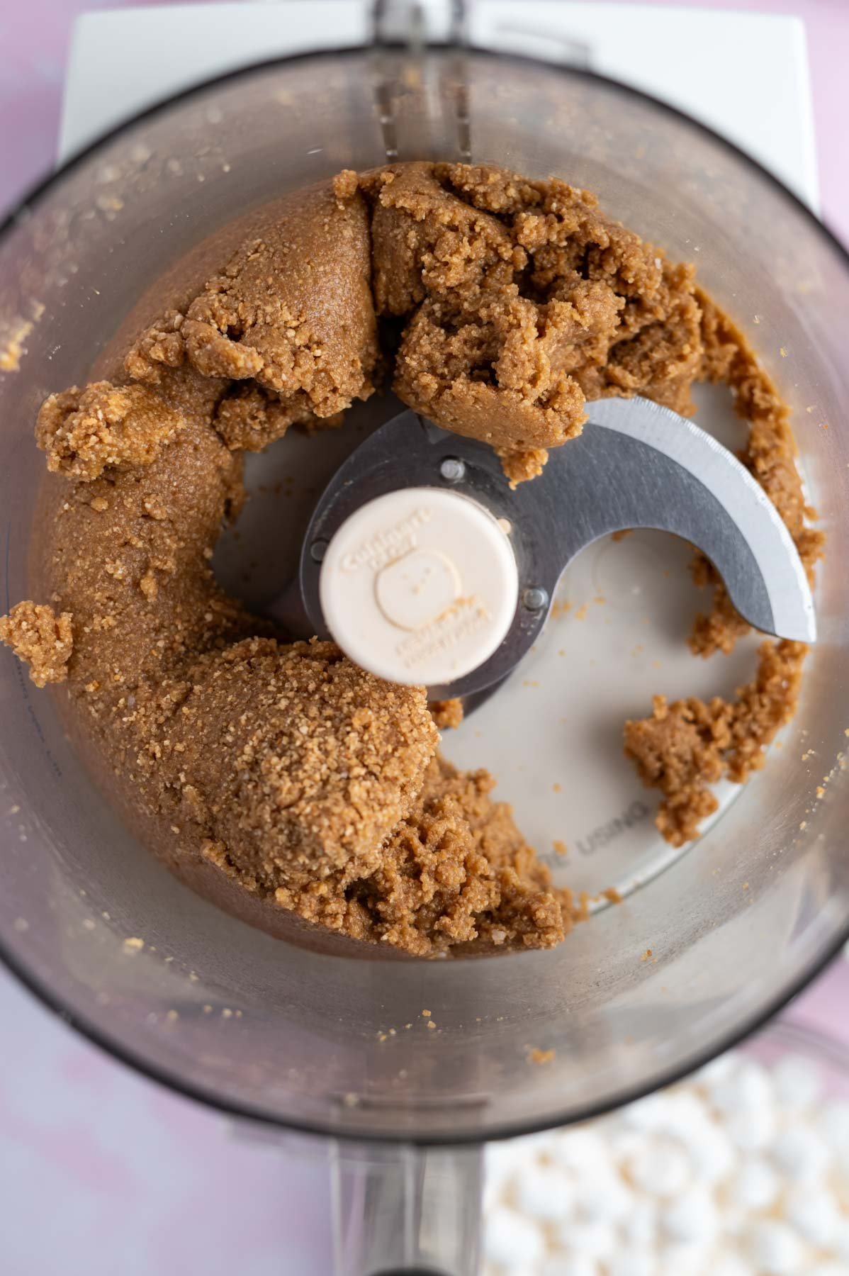 smores cookie bars dough in the bowl of a food processor