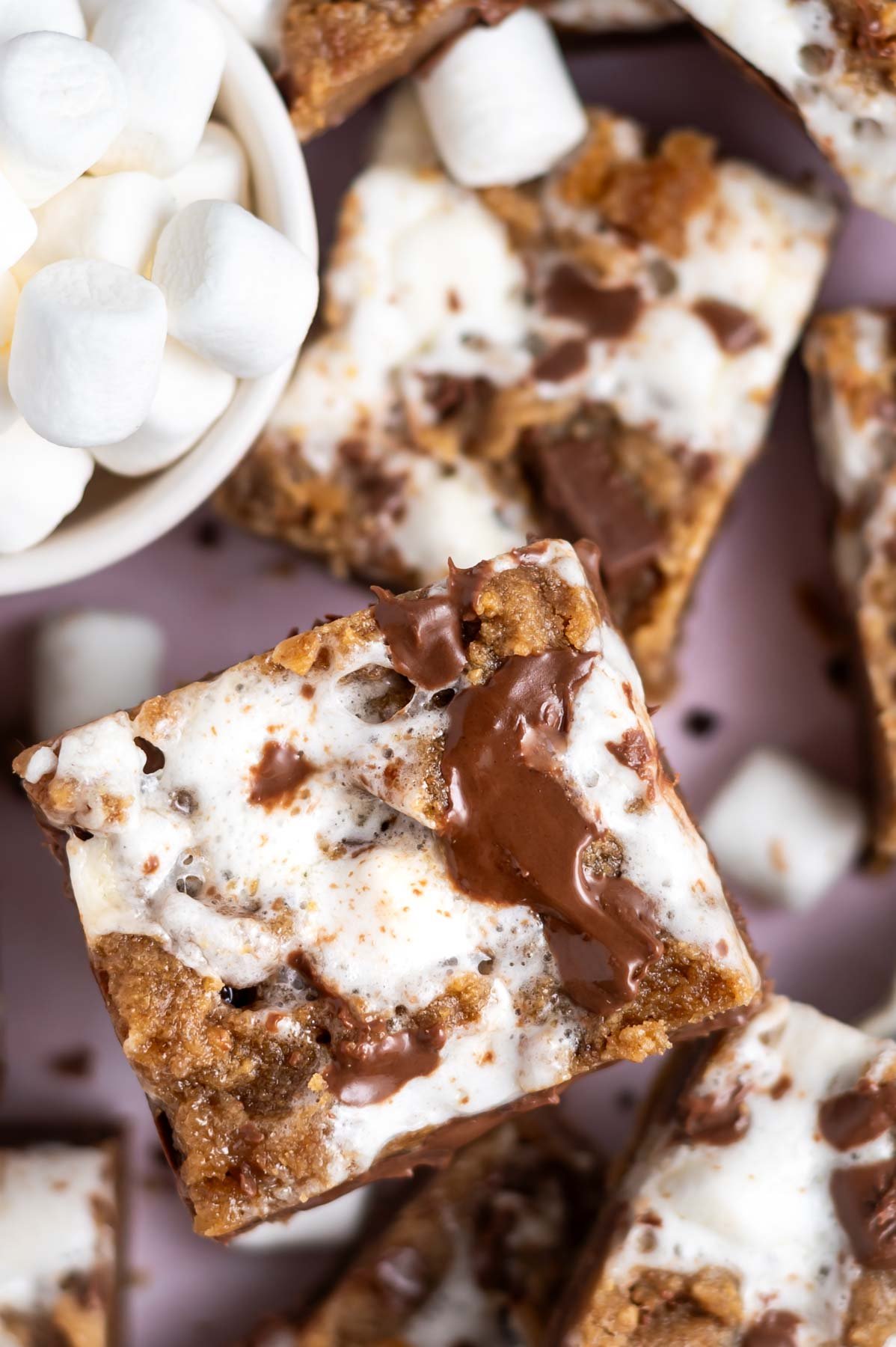 upclose look at melty marshmallows and melty chocolate on dessert bars