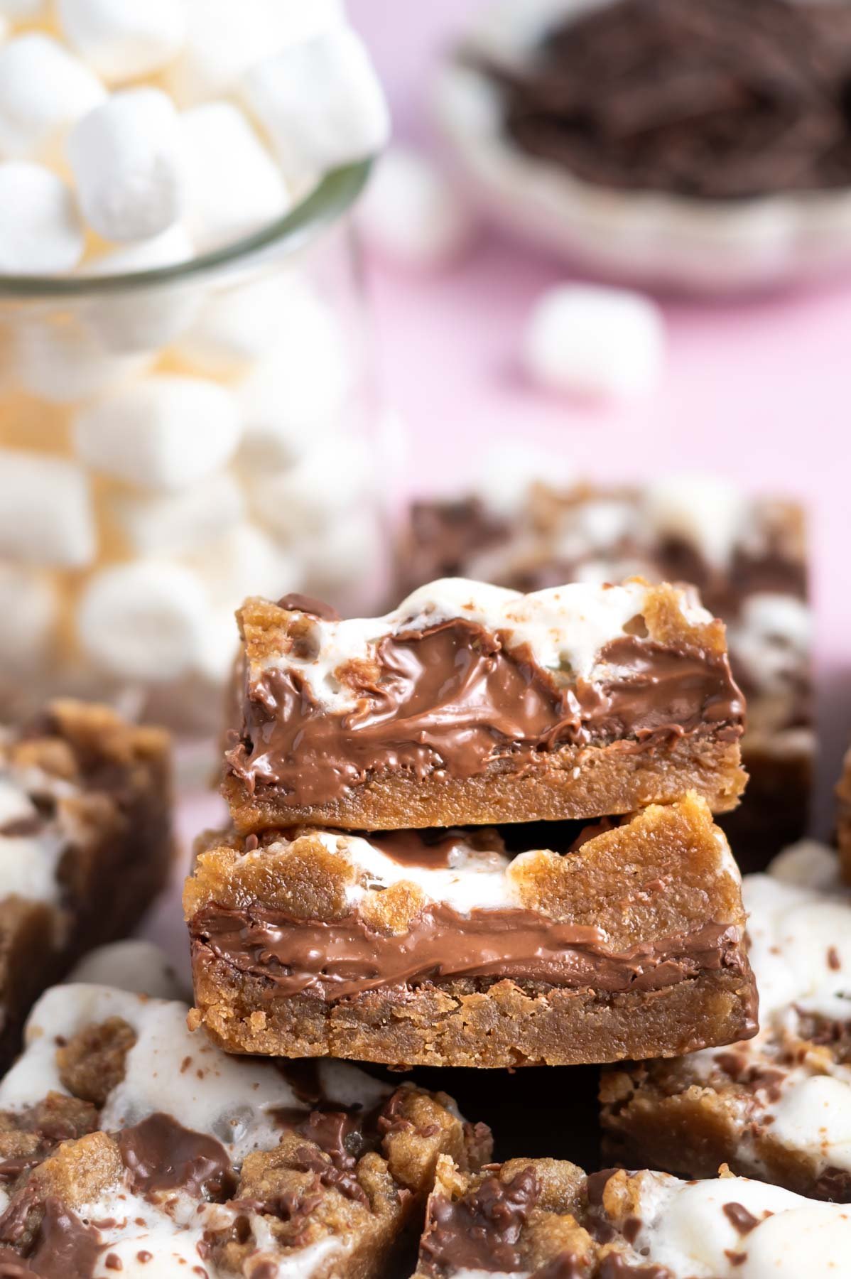 melty chocolate centers in layered smores cookie bars