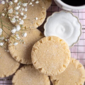 small batch sugar cookies with a bowl of sugar and cup of coffee