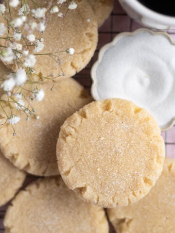 small batch sugar cookies with a bowl of sugar and cup of coffee