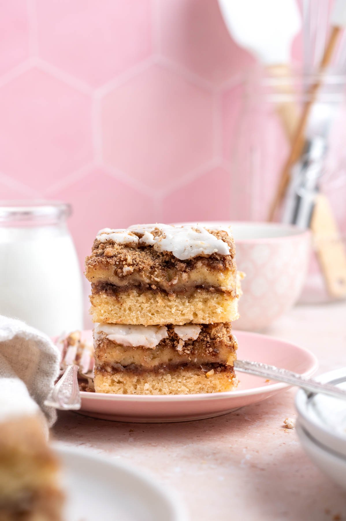 stack of cinnamon walnut coffee cake slices on a plate