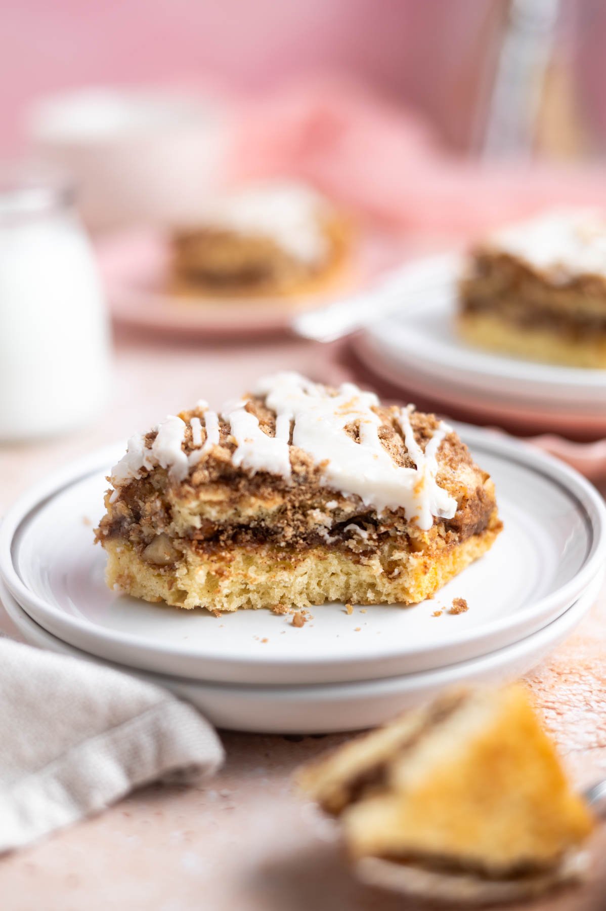 slice of cake on a plate with other slices in the background