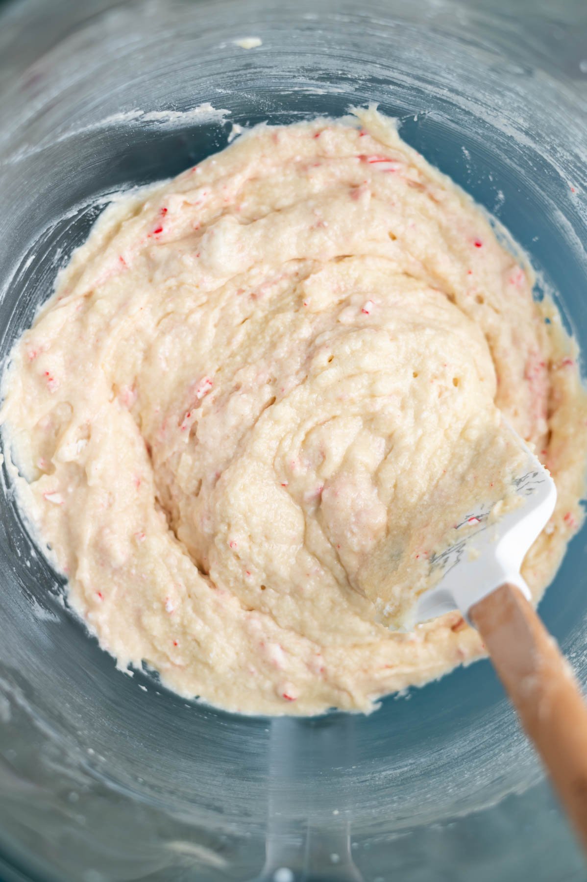 cake batter with a spatula in a mixing bowl