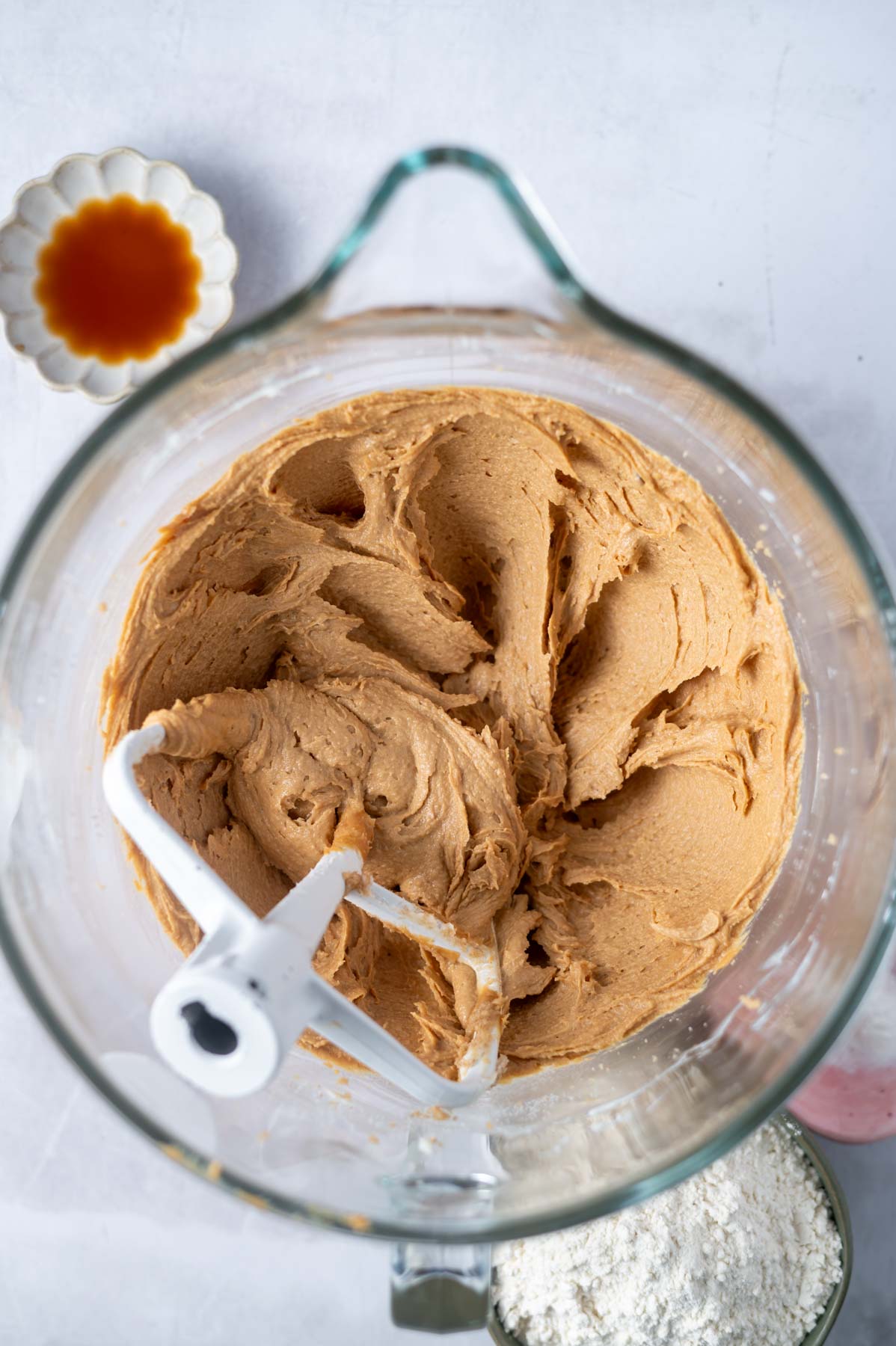 peanut butter creamed into butter and sugar in a mixing bowl