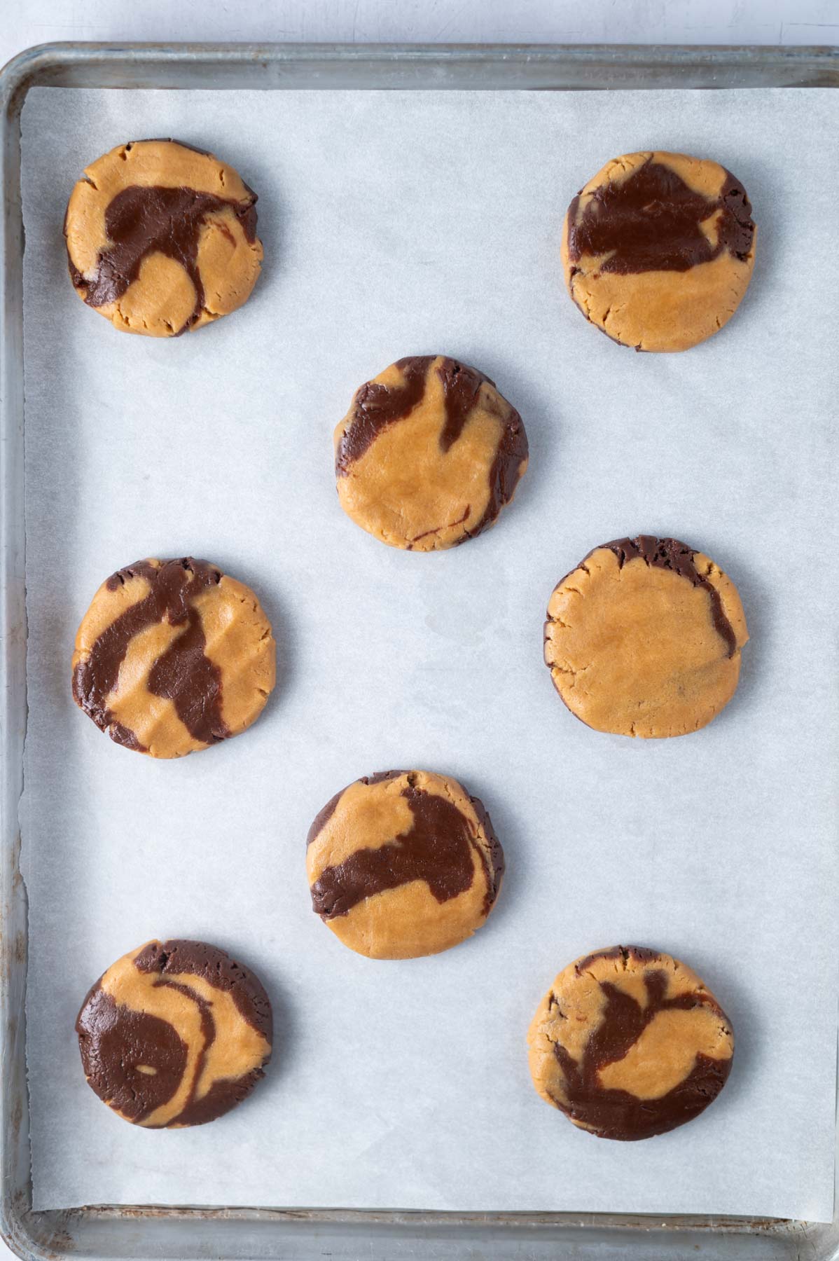 cookie dough on a parchment lined baking sheet