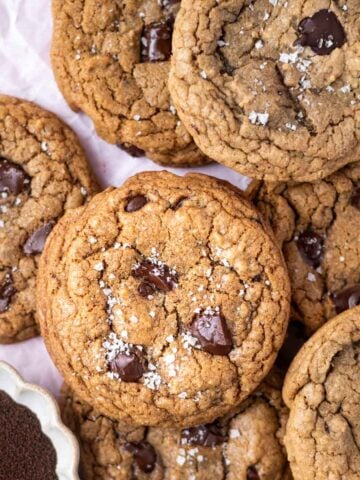 salted espresso chocolate chip cookies with a bowl of espresso powder