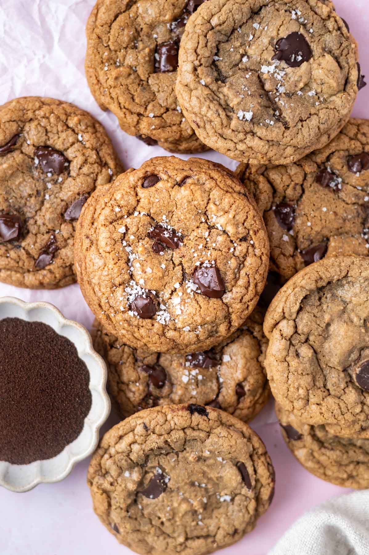 cookies on parchment paper with a bowl of instant espresso powder