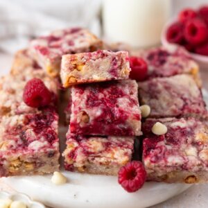 raspberry blondies with milk and extra berries and white chocolate chips
