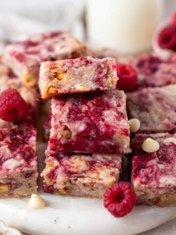 raspberry blondies with milk and extra berries and white chocolate chips