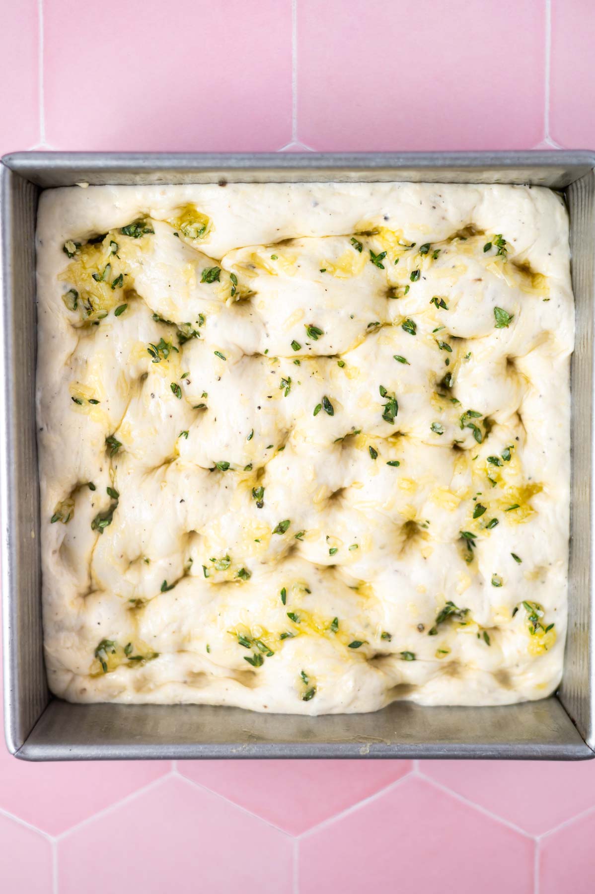 unbaked dough with olive oil and herbs