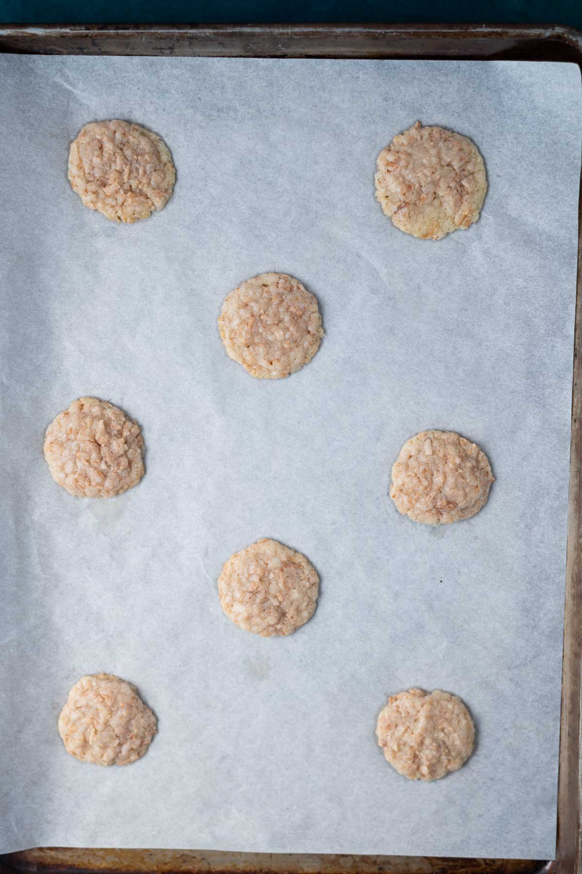 baked cookies on a parchment lined baking sheet