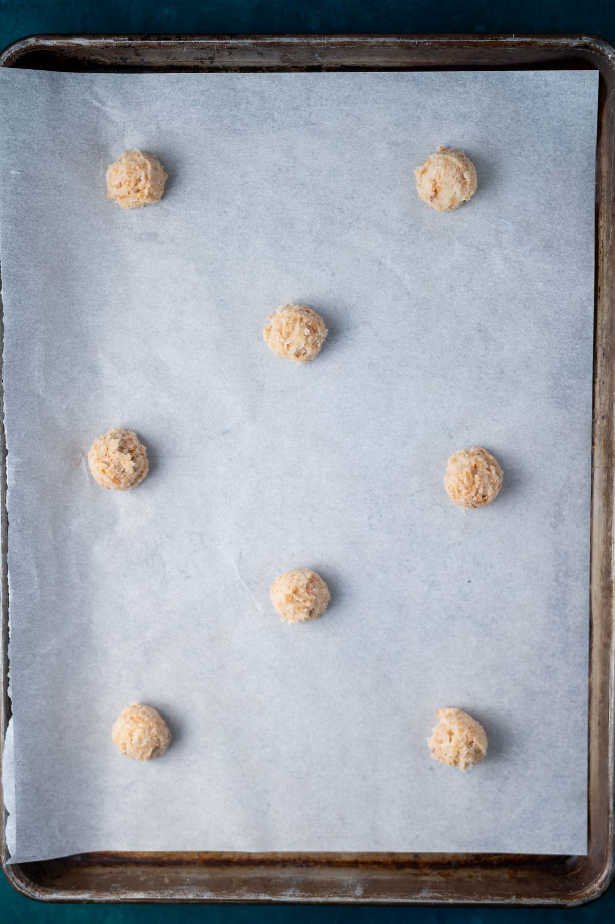 cookie dough on a parchment lined baking sheet