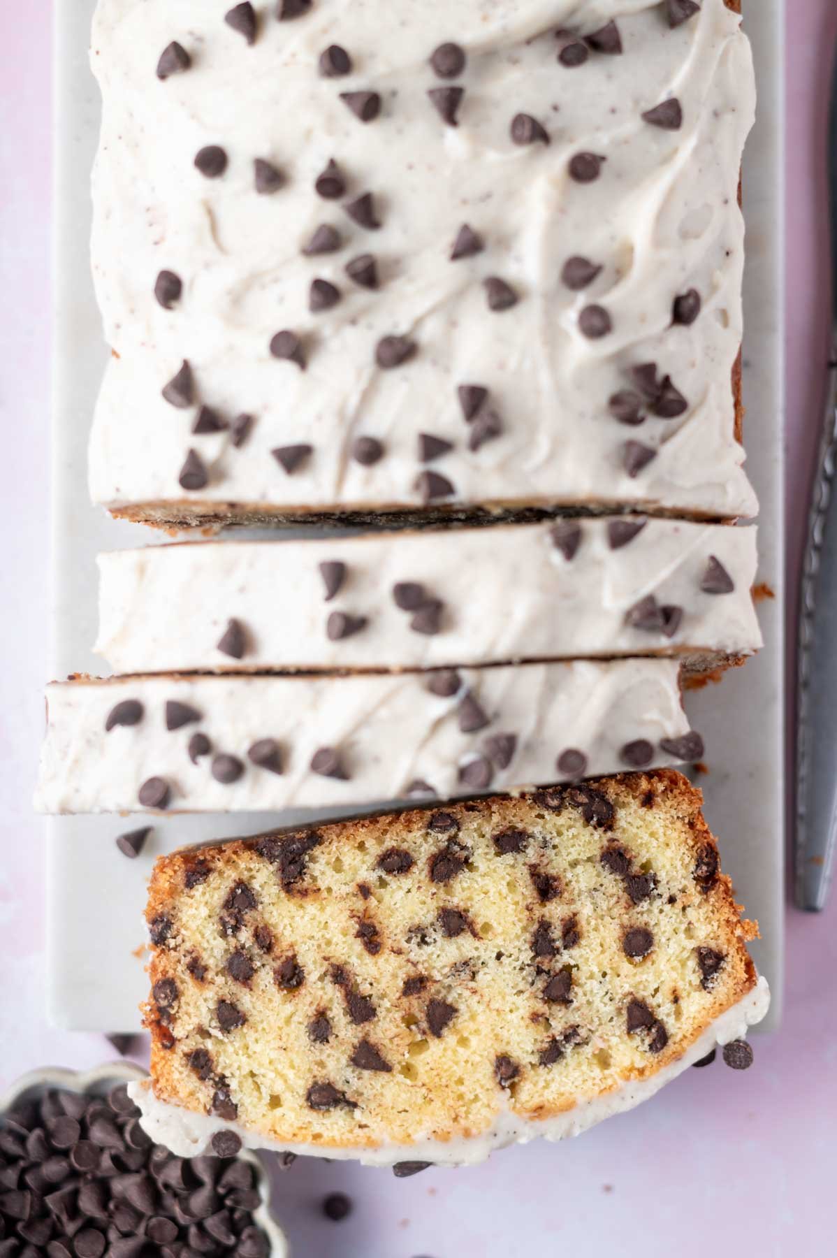 downward look at pound cake cut in slices on a marble board