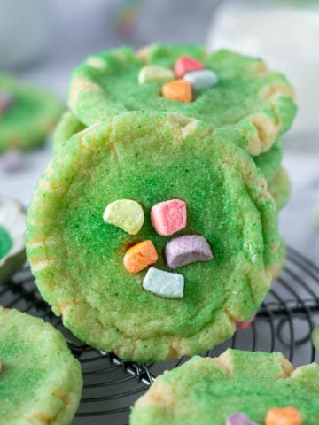 stack of st patrick's day sugar cookies with colored cereal marshmallows