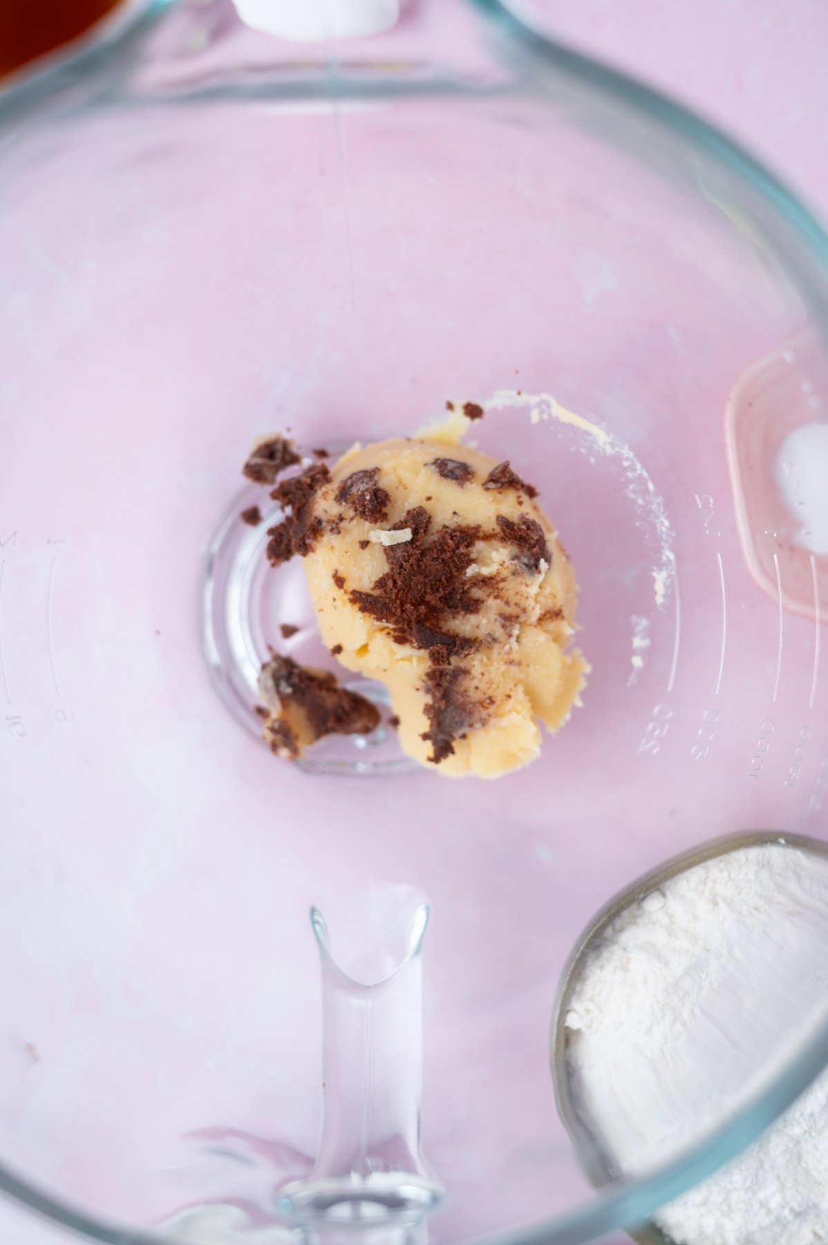 brown butter in a mixing bowl, showing brown bits of the butter