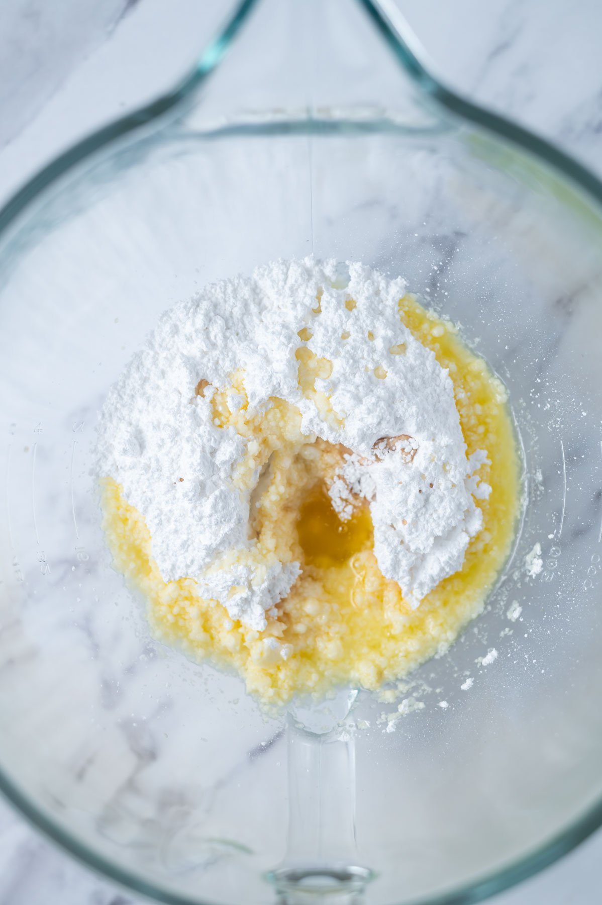melted butter, confectioners' sugar and vanilla in a mixing bowl